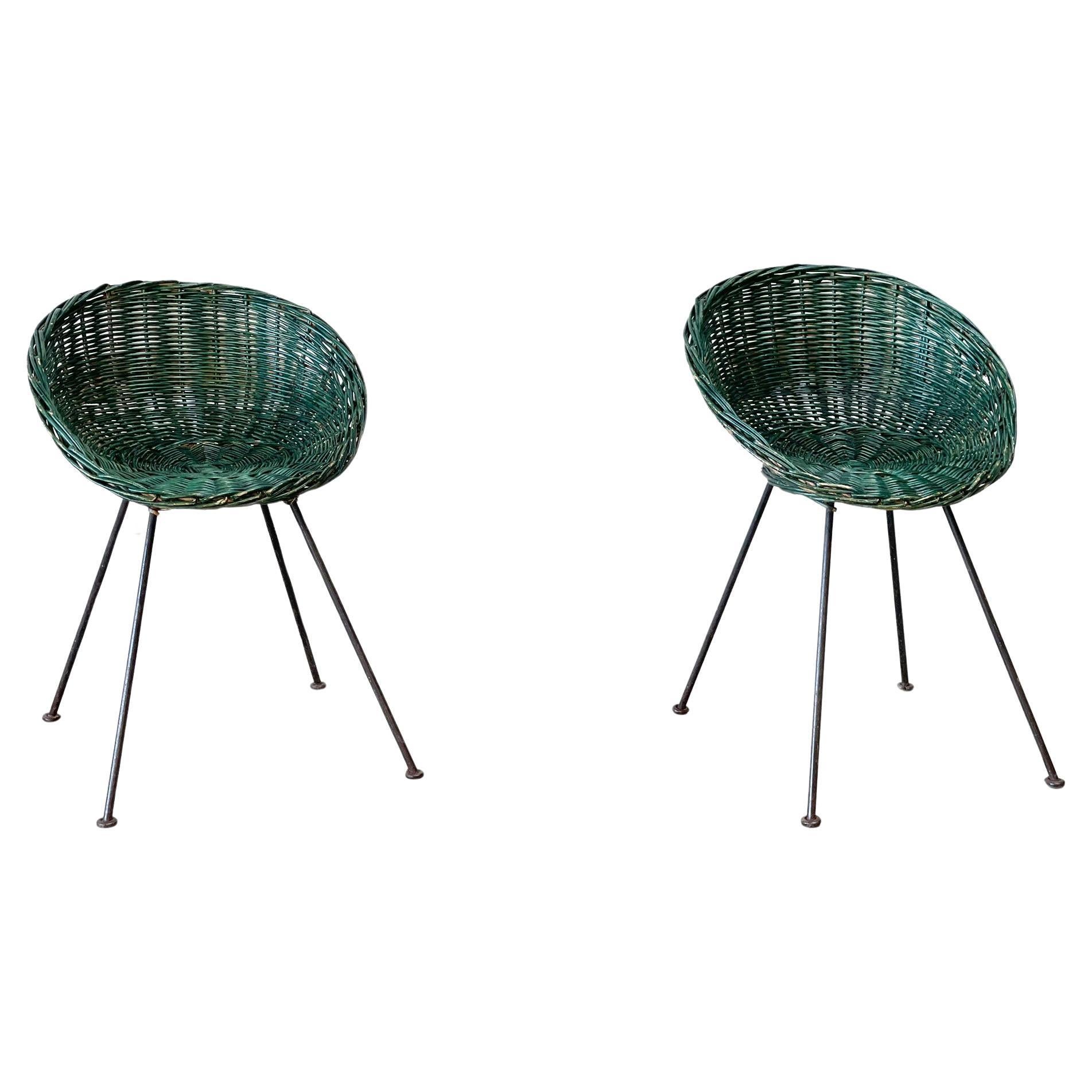 Set of two green rattan easy chairs