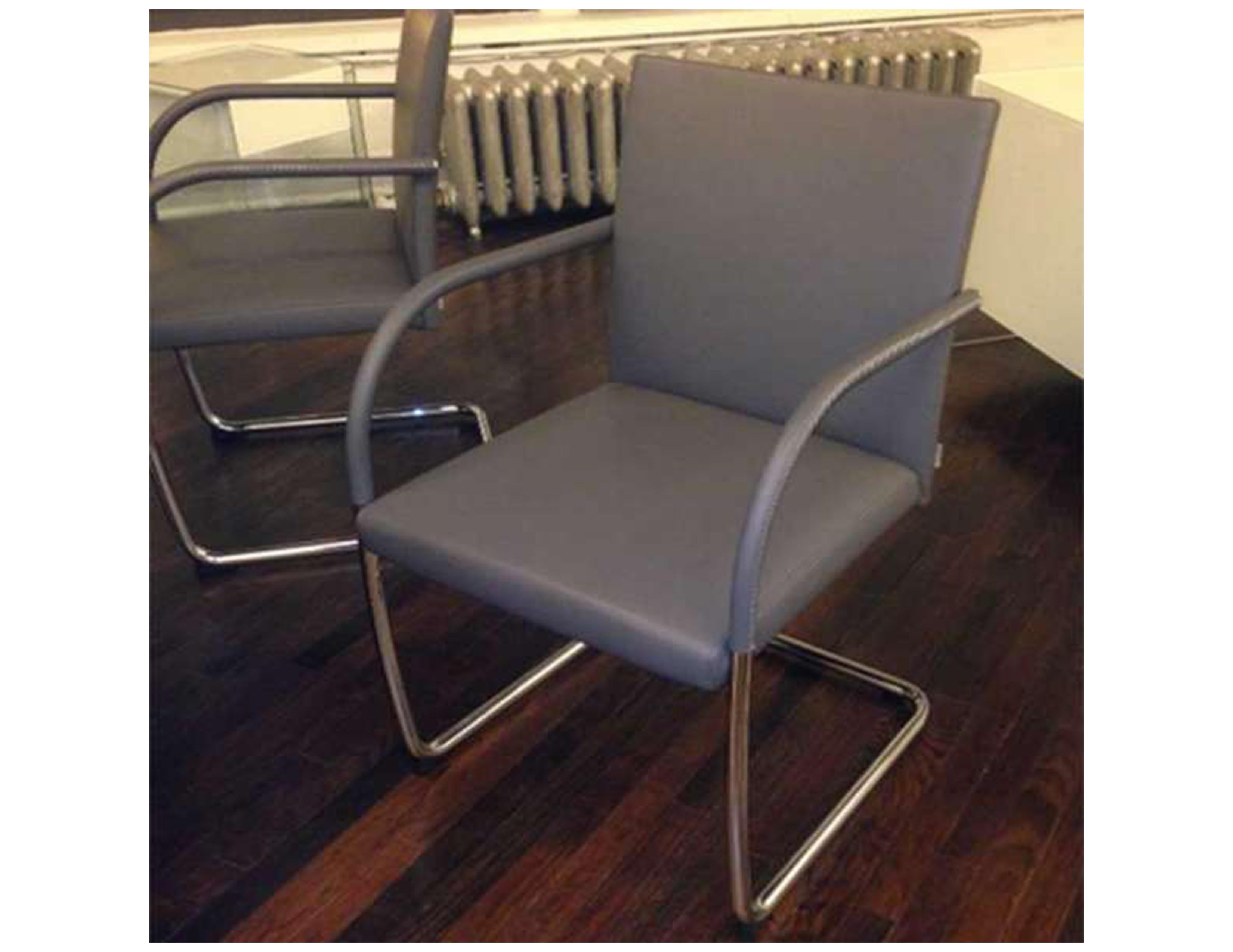(2) George armchairs
 Leather covered armrests
Model# 1562
Grey leather
Cantilever base
Original price: 2,073.00 ea.