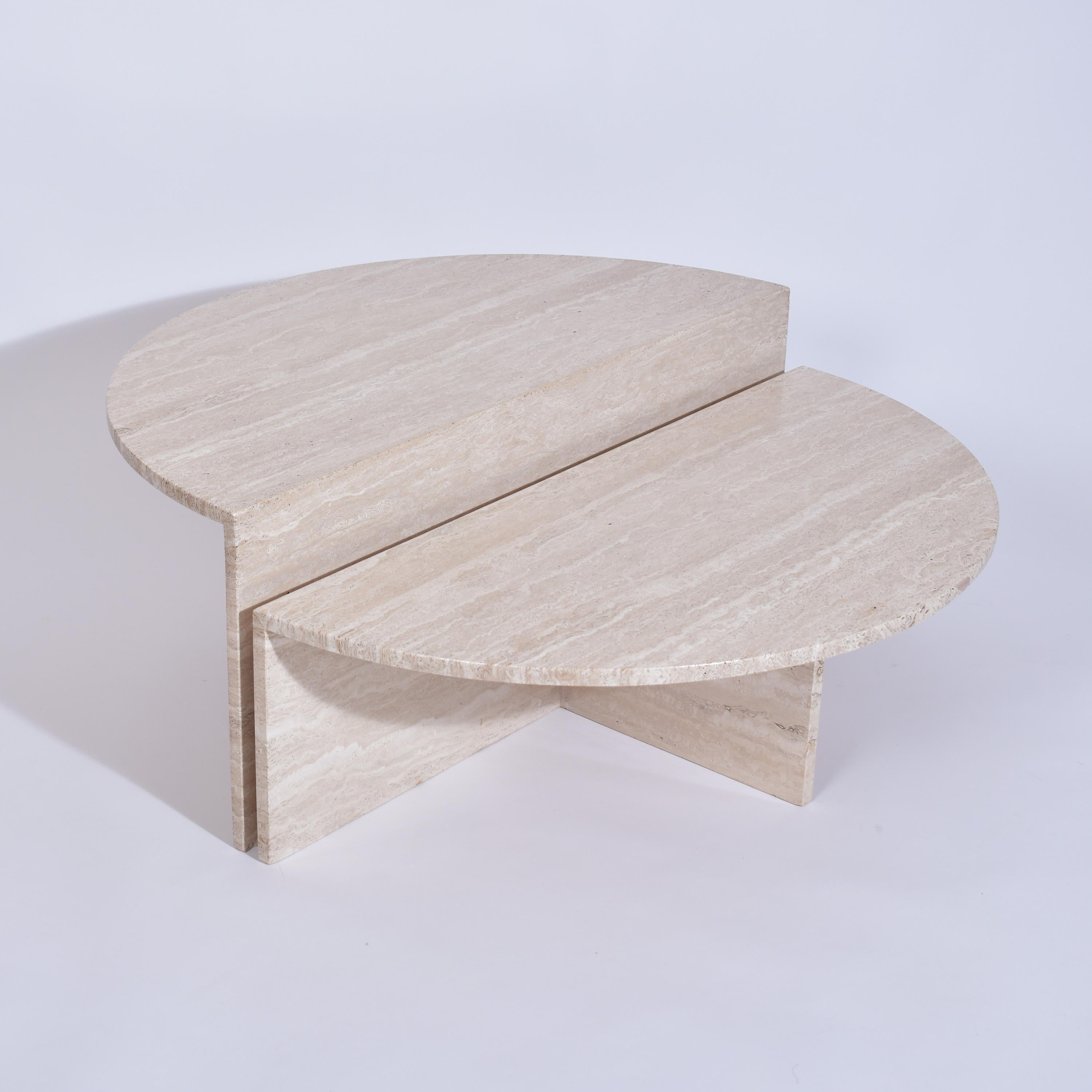 Set of two cream travertine coffee tables.
The half round tables have a different height ( 30 cm / 11.8'' ) ( 40 cm / 15.7''. )
They can be used together or separately, giving a strong architectural and classical touch.
Travertine offers pleasing