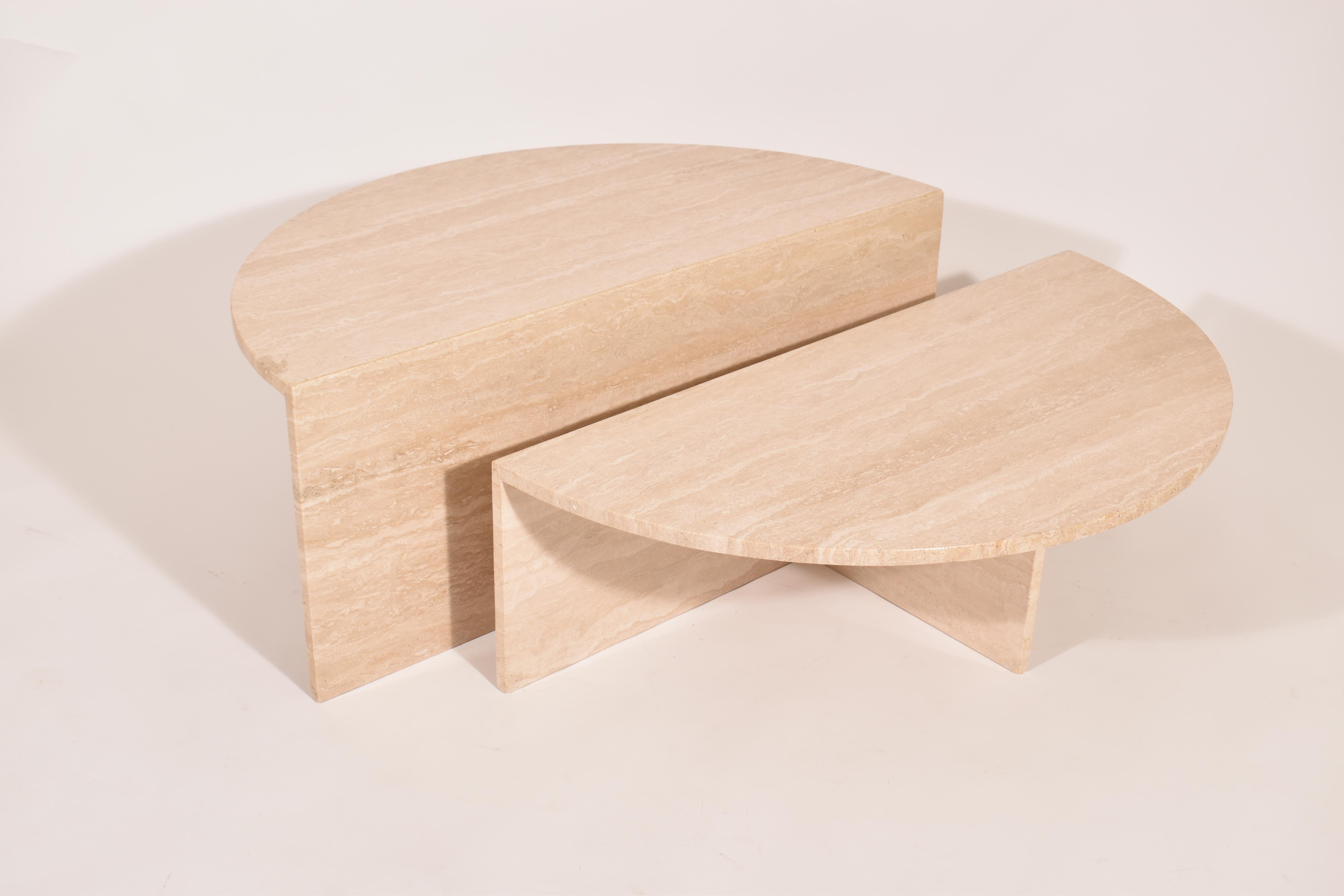 Set of two cream travertine coffee tables, made by Up & Up in Italy, between 1970 and 1980.
The half round tables have a different height ( 30 cm / 11.8'' ) ( 40 cm / 15.7''), so they can be used together (tight or loose), or separately, giving a