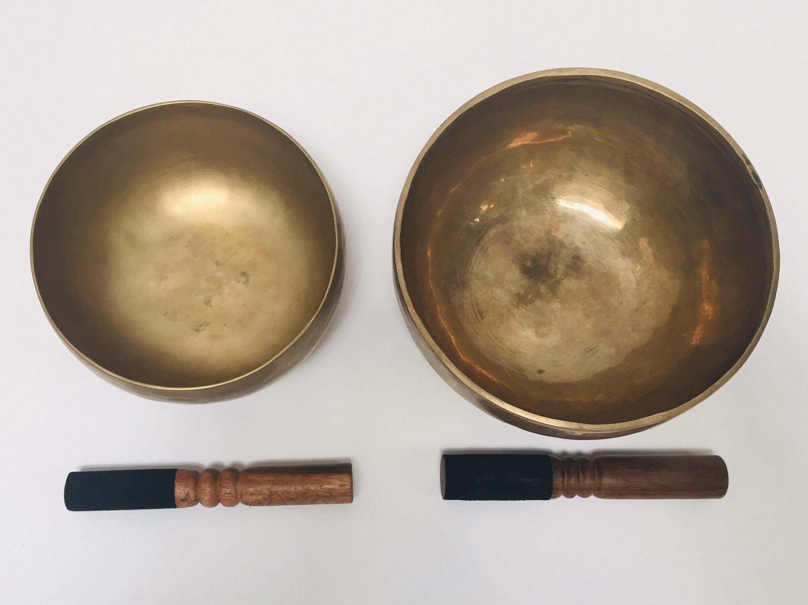 Set of two large hand-hammered Tibetan brass bowls are used in some Buddhist religious practices to accompany periods of meditation and chanting.
They have become popular with music therapists, sound healers and yoga practitioners.
The singing