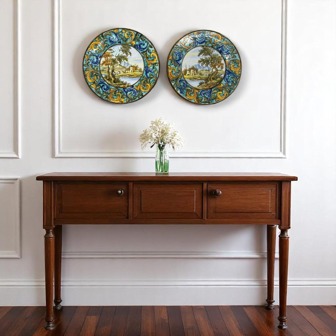 Set of Two Hand-Painted Italian Majolica Plates by N. Tapolini, Castelli, 1977–1978. A beautiful pair of hand-painted decorative majolica plates signed by N. Tapolini, crafted in Castelli. Each plate features intricate, Renaissance-inspired figural