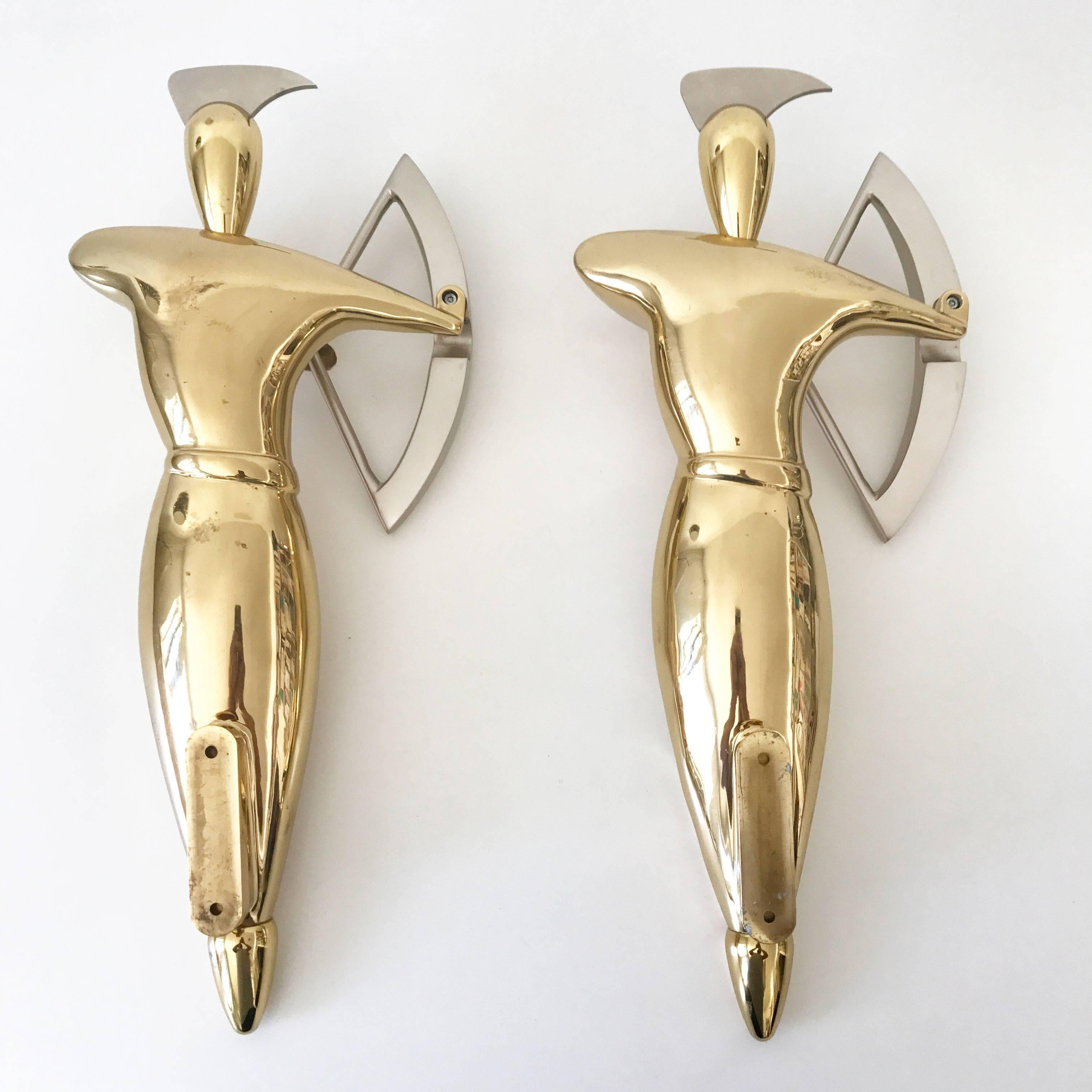Set of two exceptional Hollywood Regency wall mount decorative brass and steel archers. 
Designed and manufactured probably in 1980s. Not marked.

Executed in massive brass and steel.

Condition:
Good  original vintage condition. Wear consistent