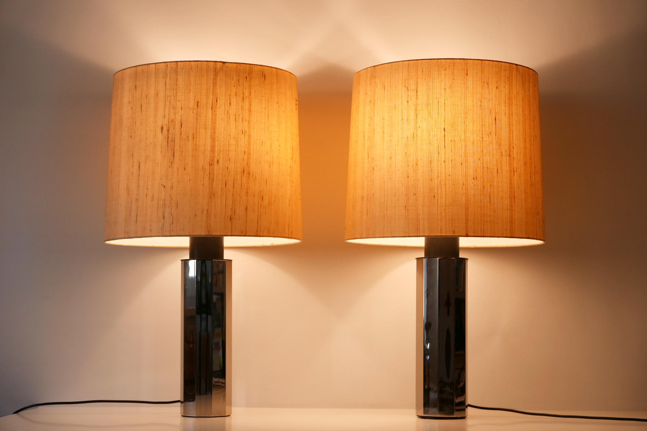 Set of two huge, exceptional and elegant Mid-Century Modern decagonal chrome-plated metal table lamps. Designed and manufactured probably 1960s in Germany.

Important notice: The lamps will be sold without lamp shades.

Executed in polished