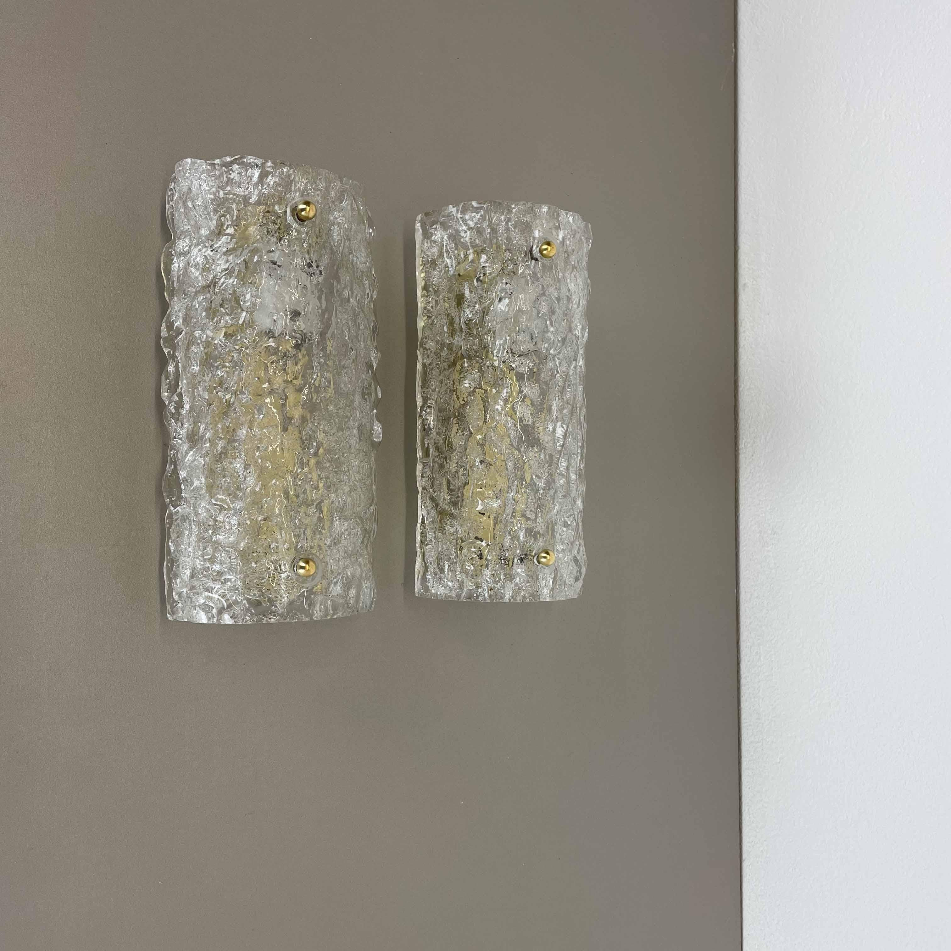 Article:

Set of two

Wall light sconces


Origin:

Germany



Age:

1970s



This set of two modernist lights was produced in Germany in the 1970s. It is made from heavy glass and has a metal wall fixation. The lights have a
