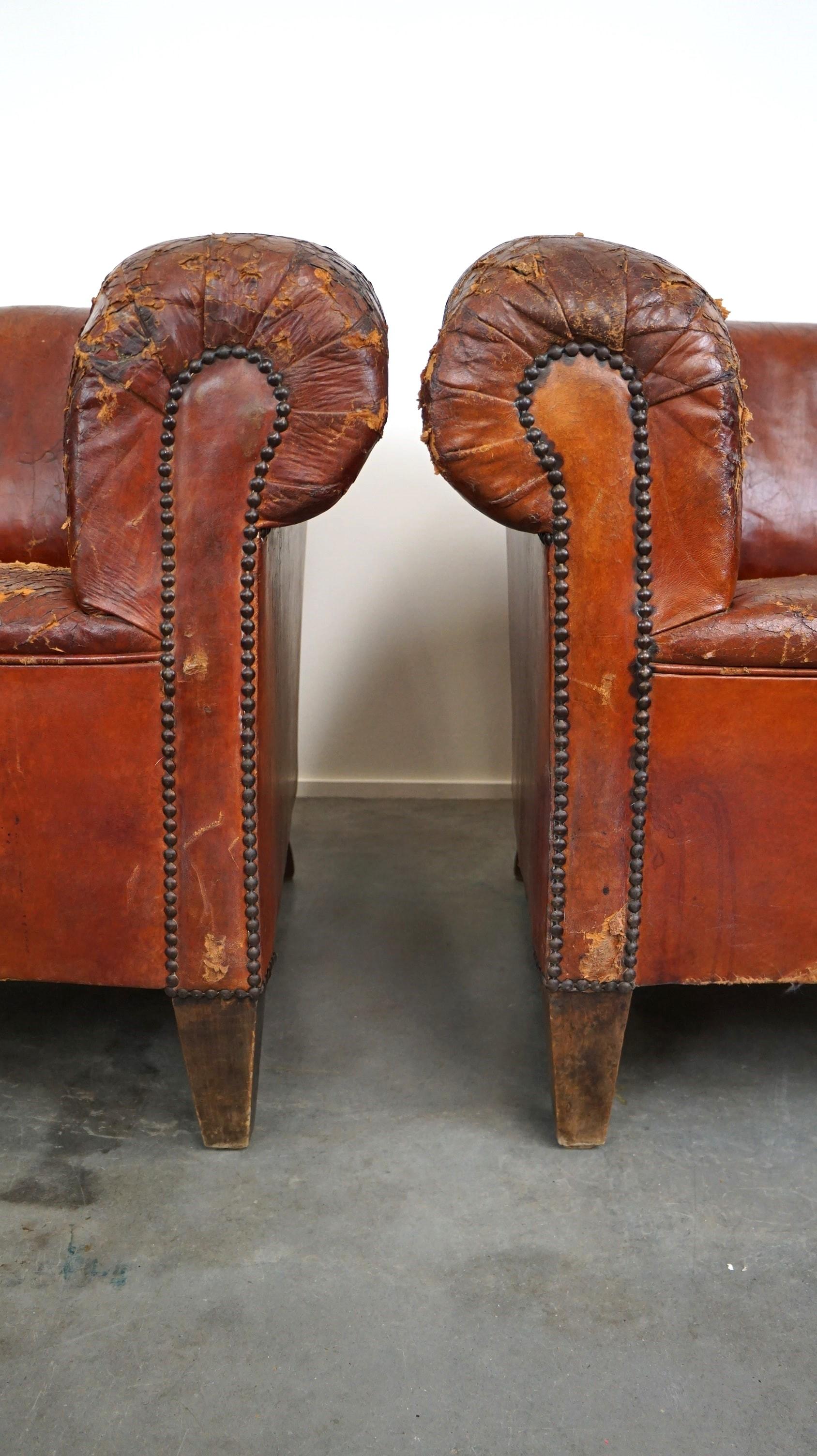 Set of two incredible antique leather club armchairs, boasting a stunning patina For Sale 5