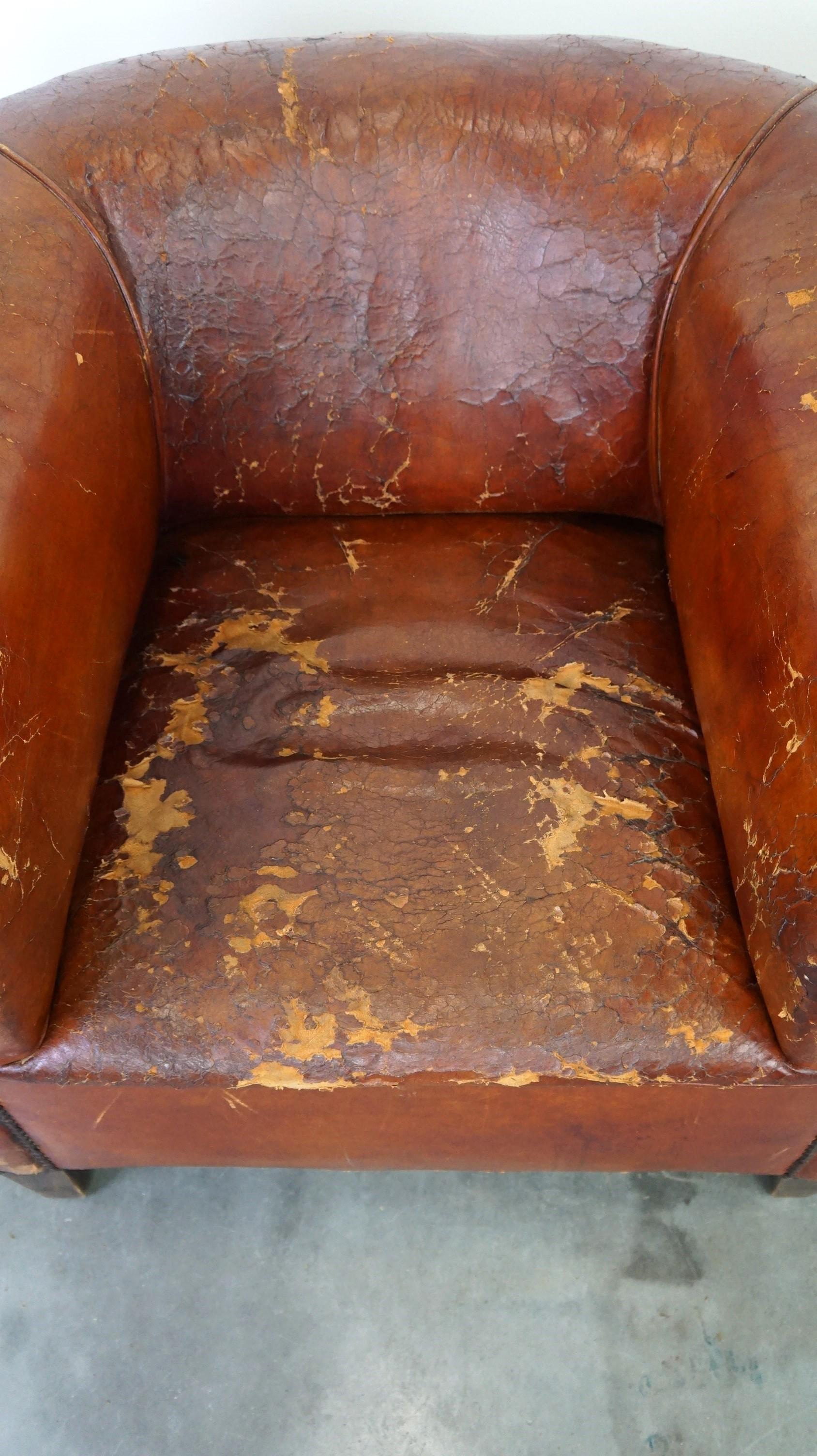19th Century Set of two incredible antique leather club armchairs, boasting a stunning patina For Sale