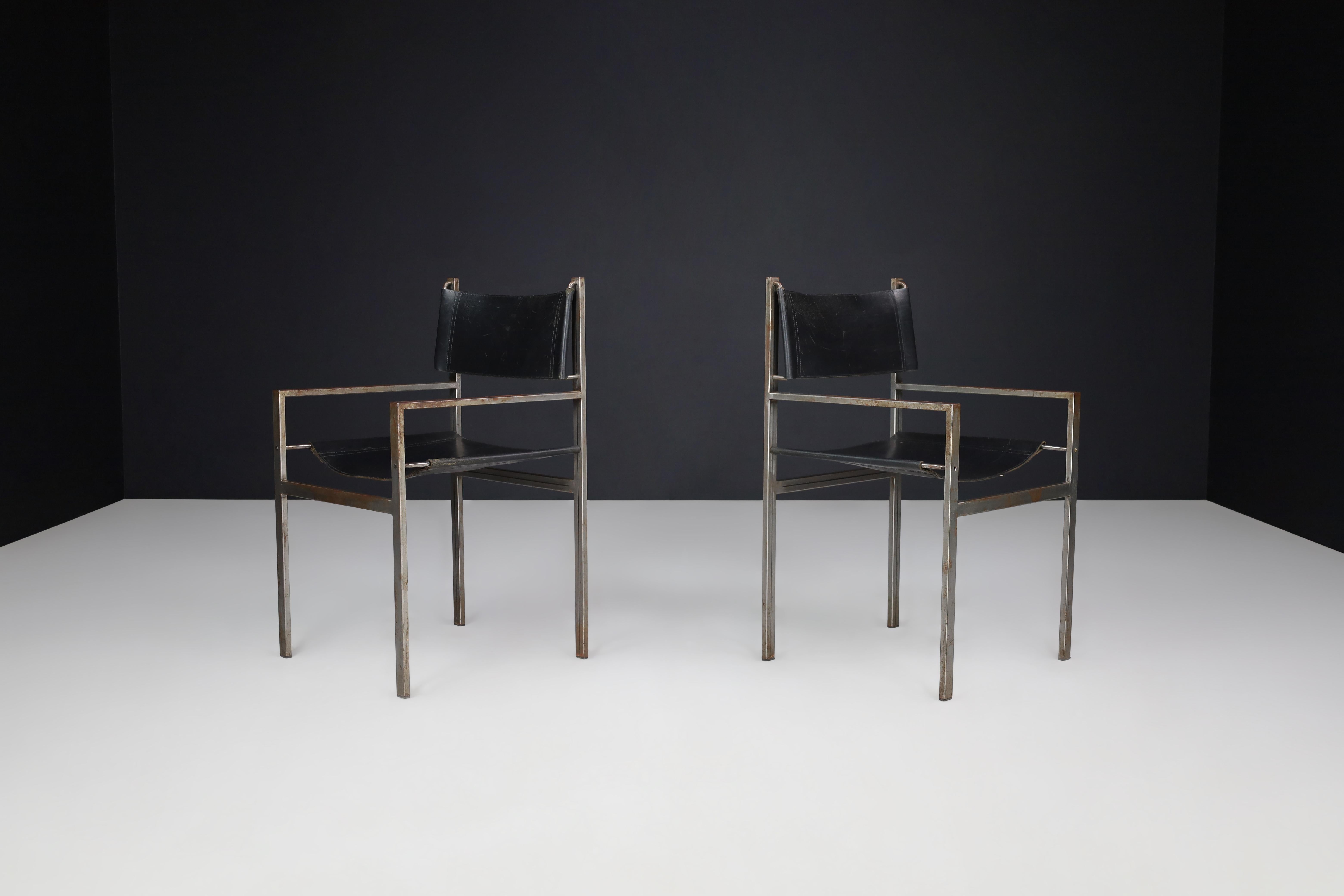 Set of Two Industrial Steel and Leather Armchairs, The Netherlands, 1960s

This rare set of two armchairs was produced in the Netherlands during the 1960s and reflects the raw elegance of early industrial modernism. With their clean, linear