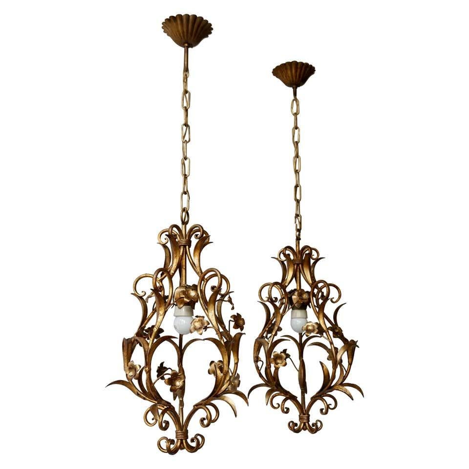 Two stylish Italian 1950s gilt-tole foliate chandeliers, ceiling lights without-scrolled leaves.

Measures: 
Diameter 32 cm.
Height 53 cm.
Total height including the chain and canopy 95 cm.