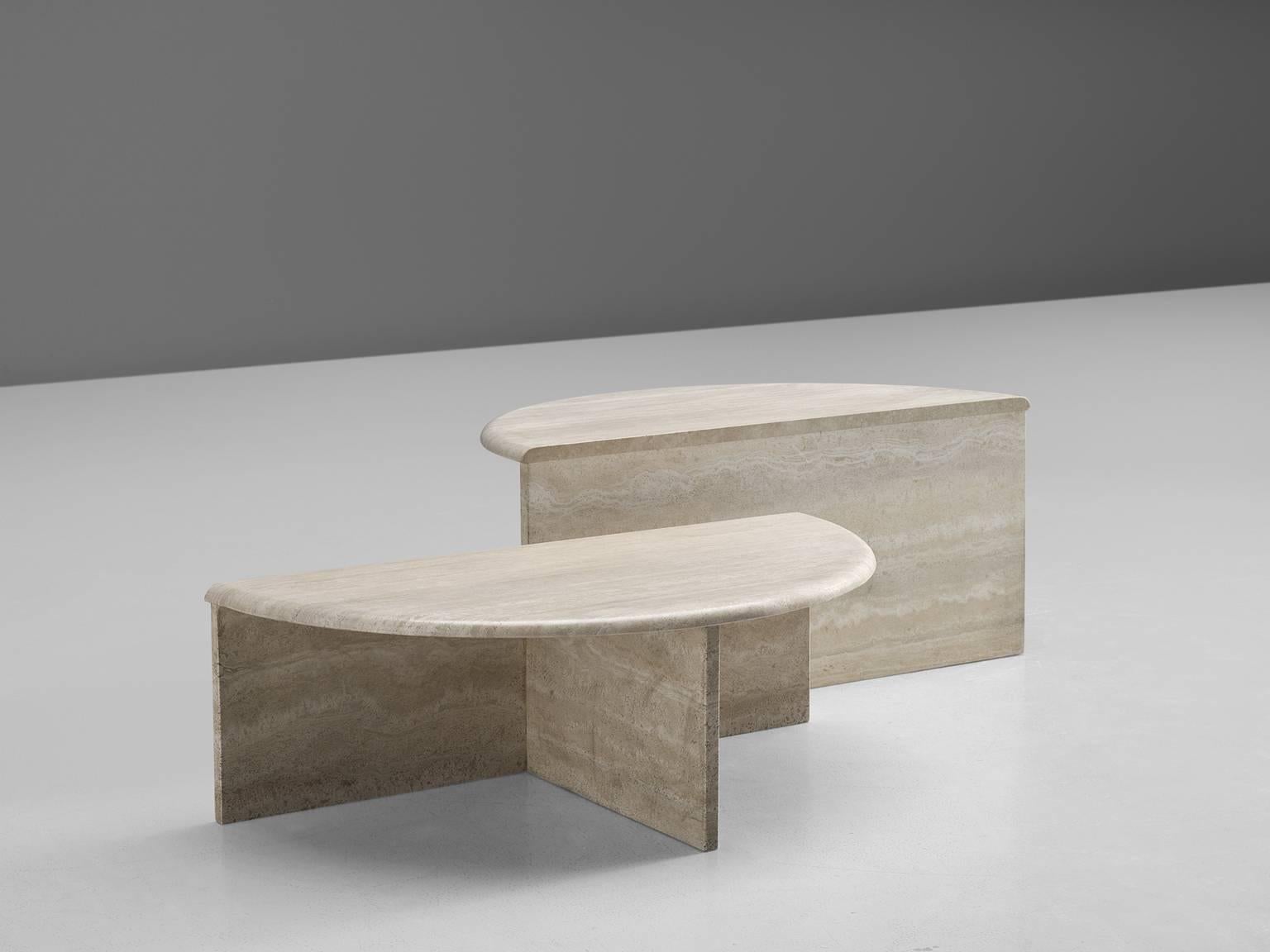 Semi-circular coffee tables in travertine, Europe, 1970s. 

The design of these two coffee table is graphical and features balanced proportions. The tables can be used in various setting by means of which different types of tables can be created.