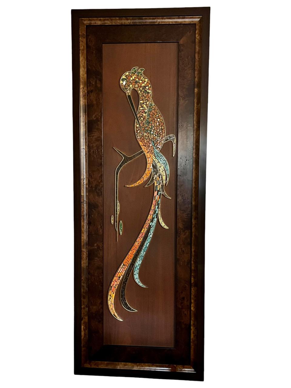 A set of two Italian glass mosaic wall appliqués from the 1960’s. One hangs horizontally and the other one vertically. They are depicting several great egret birds in a variety of colors. The mosaic work is bordered with a bronze trim. The tile