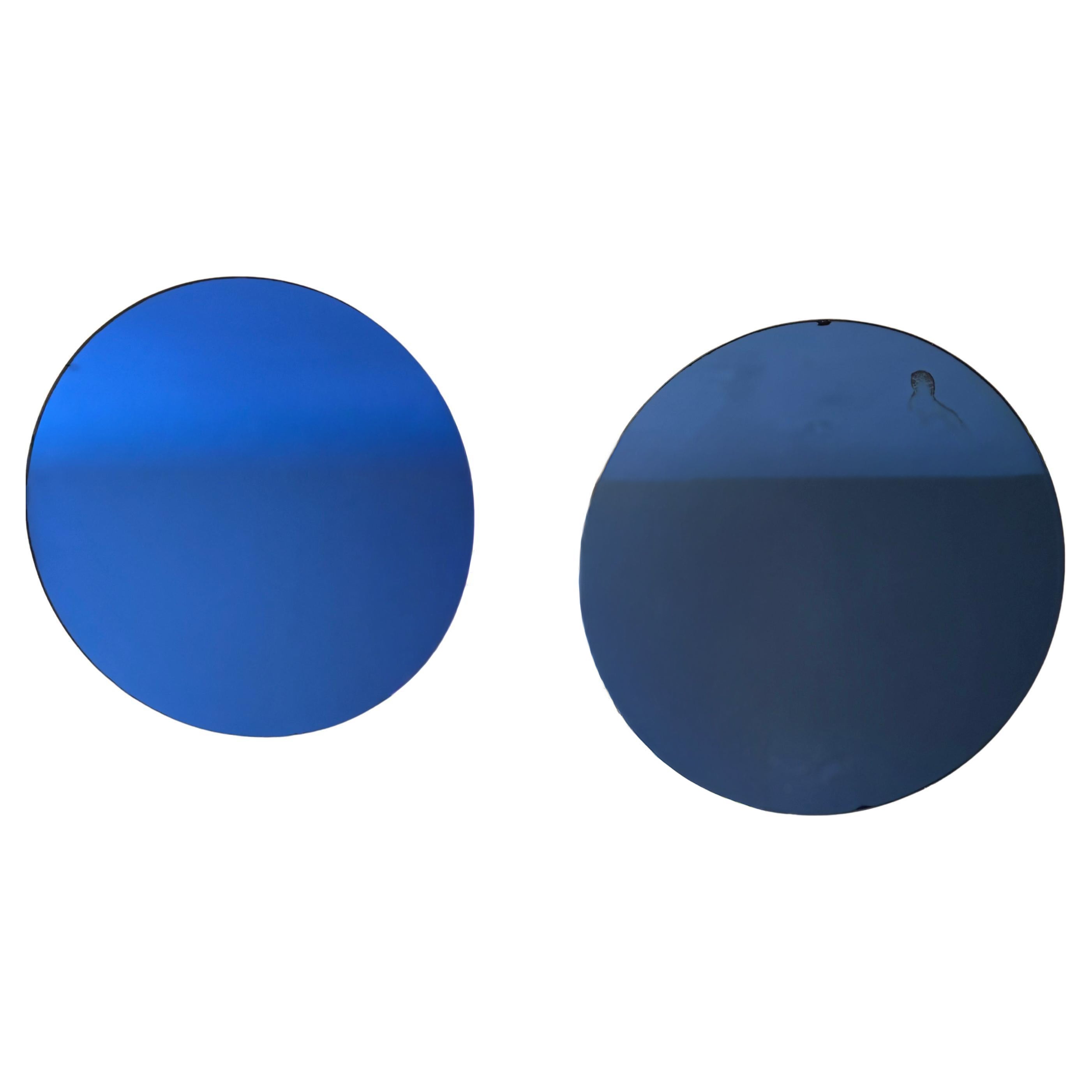 Set di due specchi italiani rotondi in vetro blu. anni
50 circa.