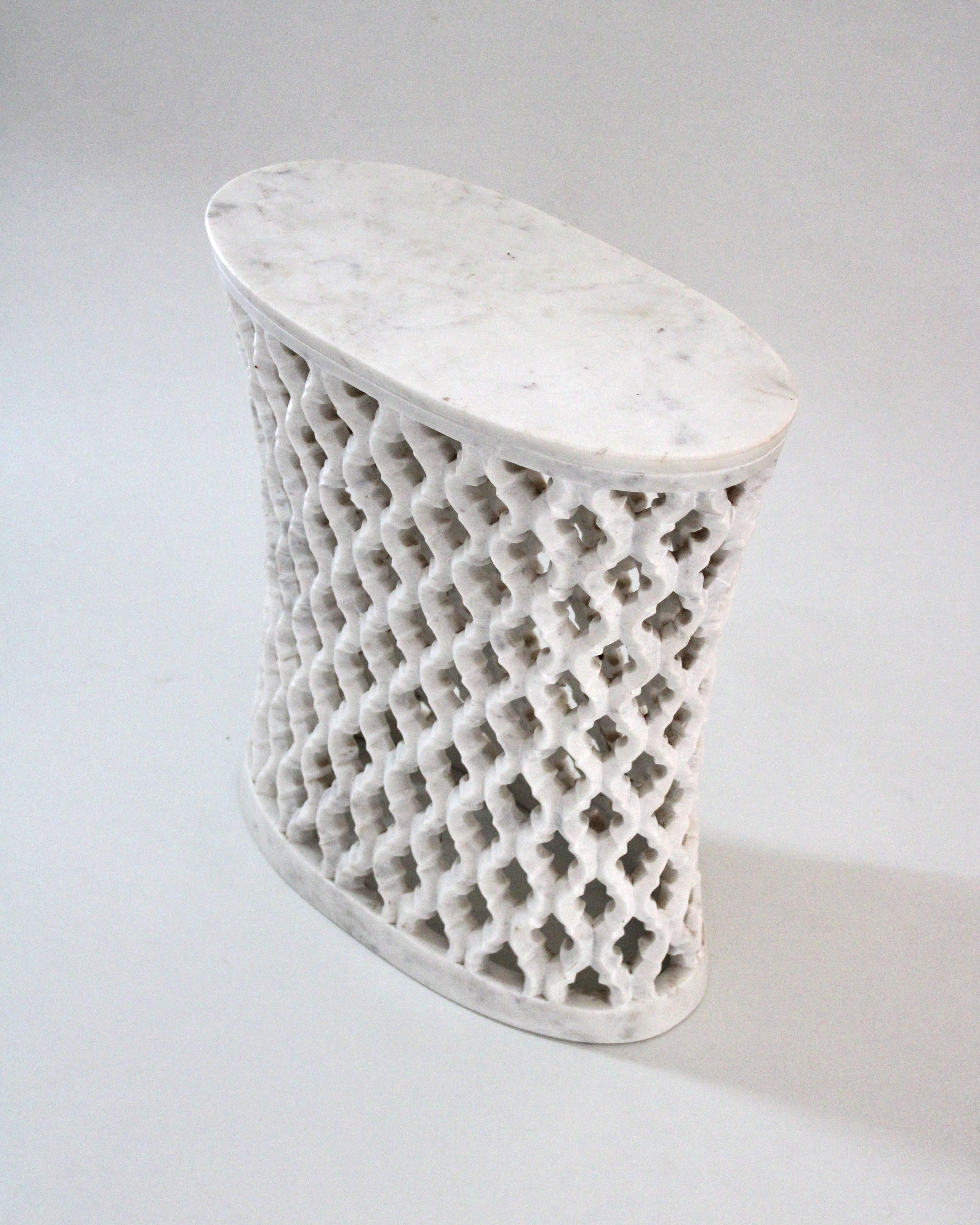 Inspired by the elegant pierced marble “jali” screens and windows he saw in the palaces of Mughal India, the renowned designer Paul Mathieu created a unique collection of hand carved side table.
 
Solid blocks of marble are hollowed out and hand