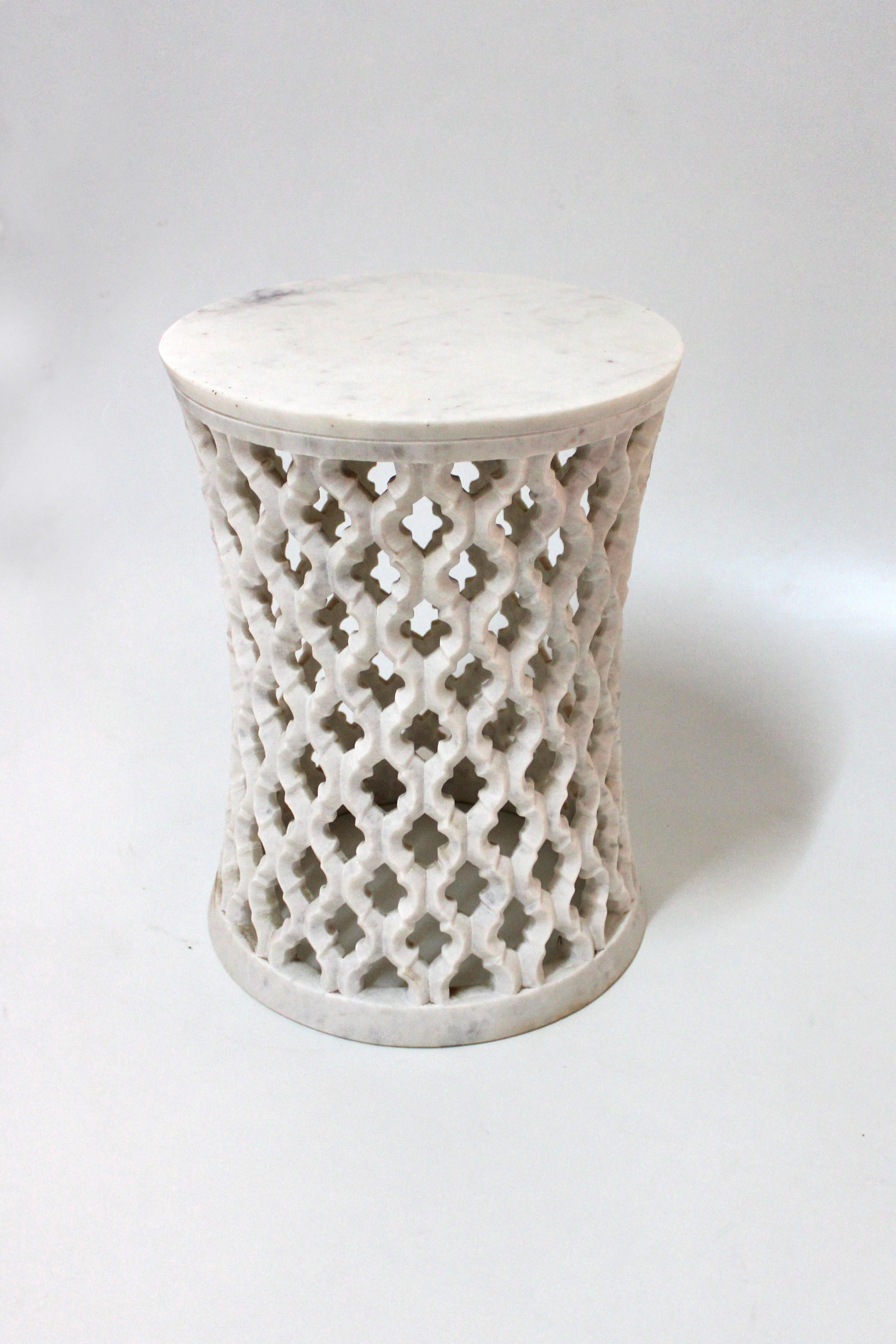 Inspired by the elegant pierced marble “jali” screens and windows he saw in the palaces of Mughal India, the renowned designer Paul Mathieu created a unique collection of hand carved side tables.
 
Solid blocks of marble are hollowed out and