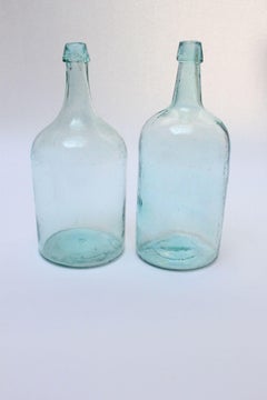 Set of Two Large Antique Molded and Hand-Finished Aqua Glass Spirits Bottles