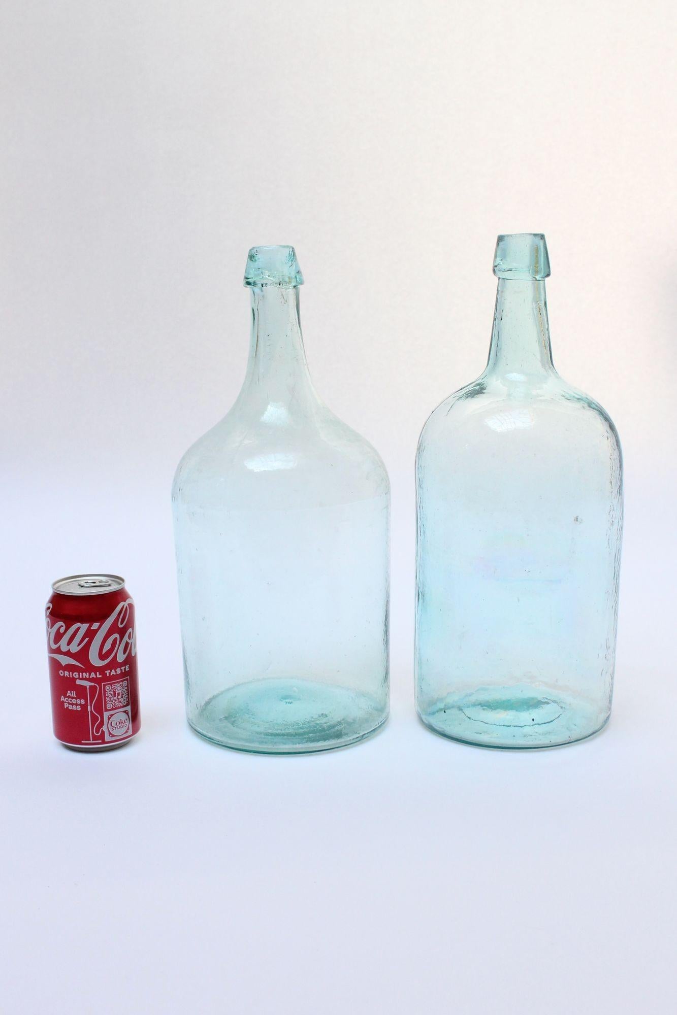 Set of Two Large Antique Molded and Hand-Finished Aqua Glass Spirits Bottles In Good Condition For Sale In Brooklyn, NY