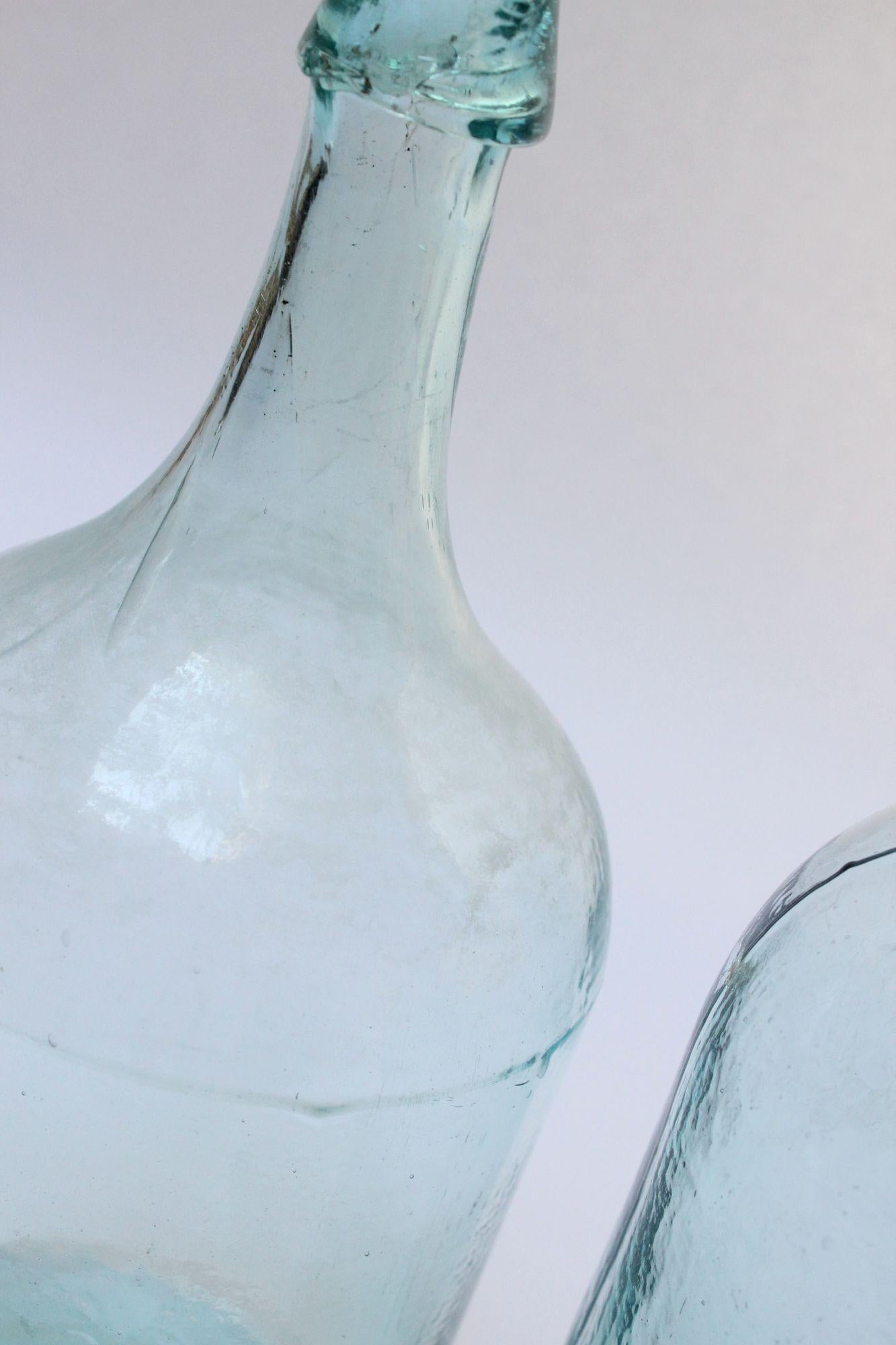 20th Century Set of Two Large Antique Molded and Hand-Finished Aqua Glass Spirits Bottles For Sale