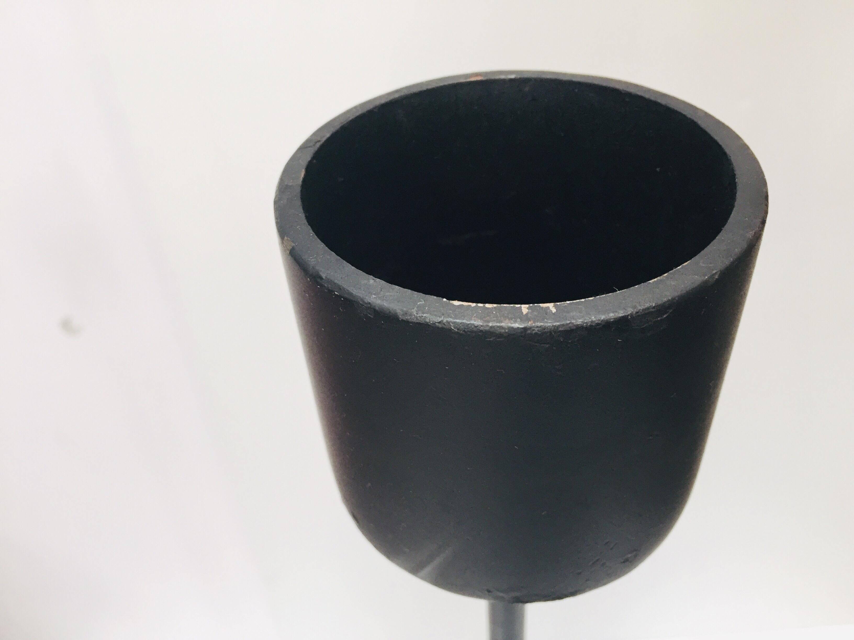 Set of two large contemporary Minimalist black metal candleholders.
The simple Minimalist modern candle stand is finished in black and hold a 3