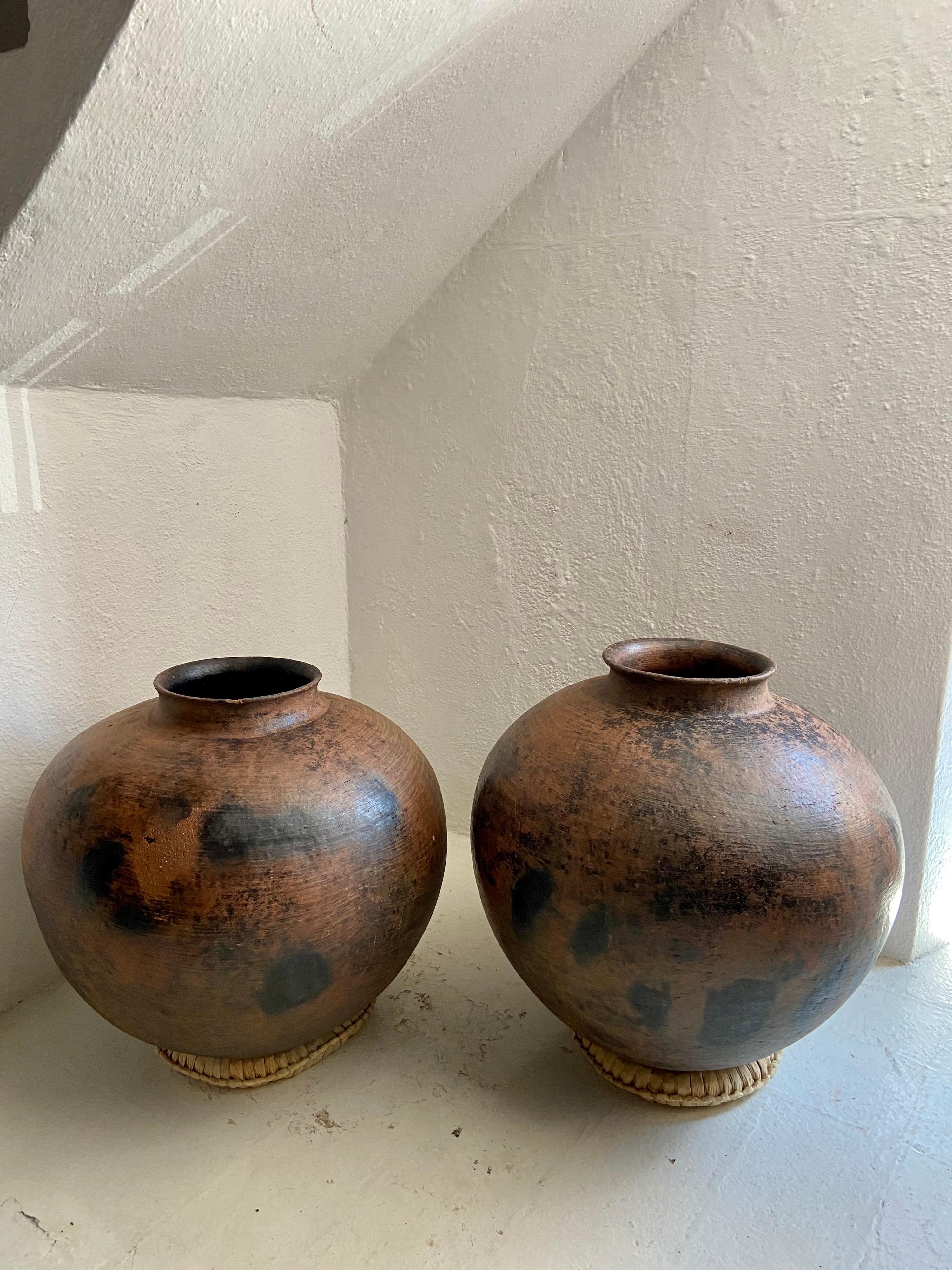 Set of two large water pots from the Mixteca Alta region of Oaxaca, Circa 1950's. Rare design from this region. Not a lot is known regarding their exact whereabouts. I have yet to see this style before.
