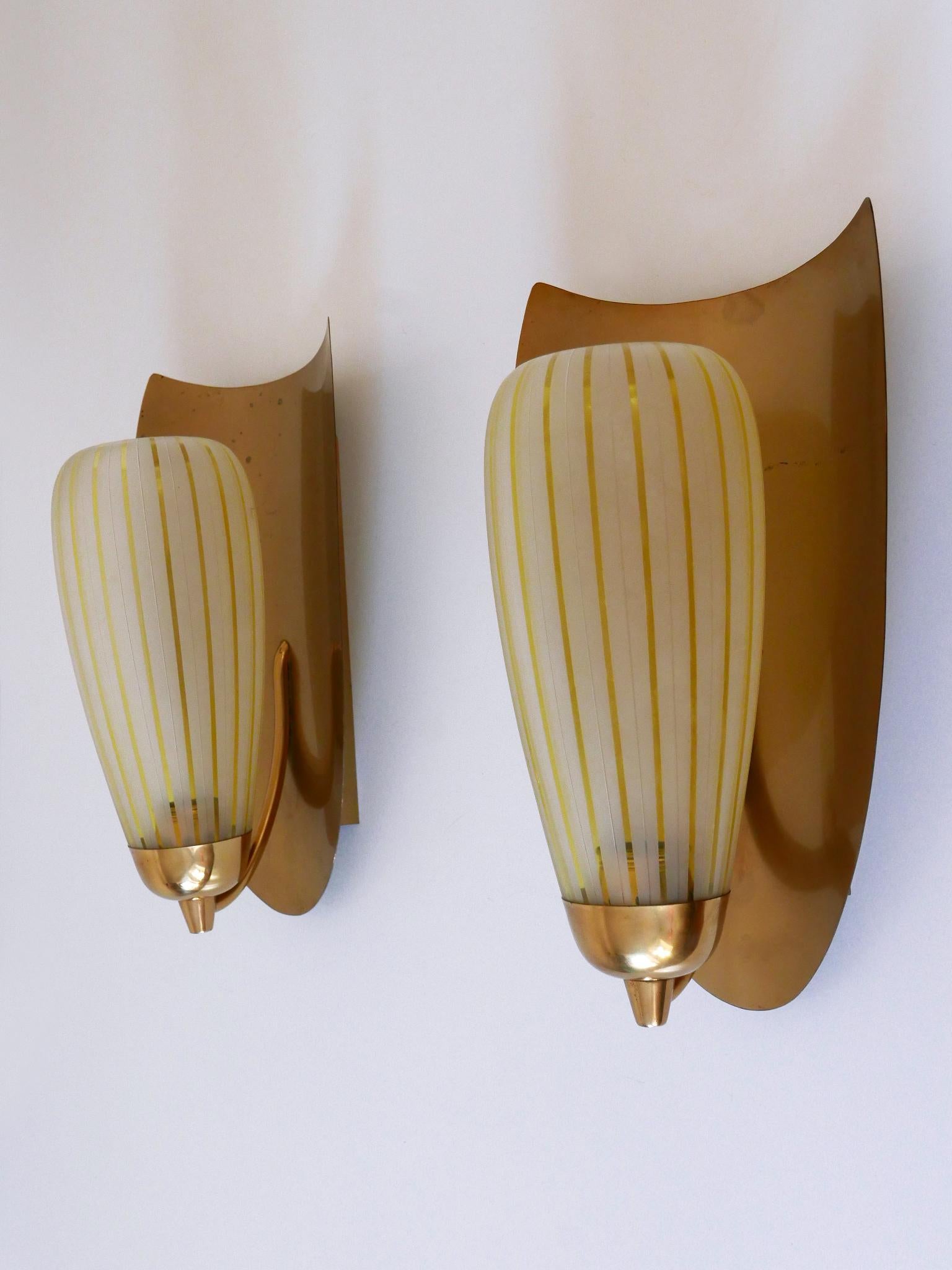 Laiton Ensemble de deux grandes appliques par Wilhelm Wagenfeld pour Peill & Putzler Allemagne années 1950 en vente