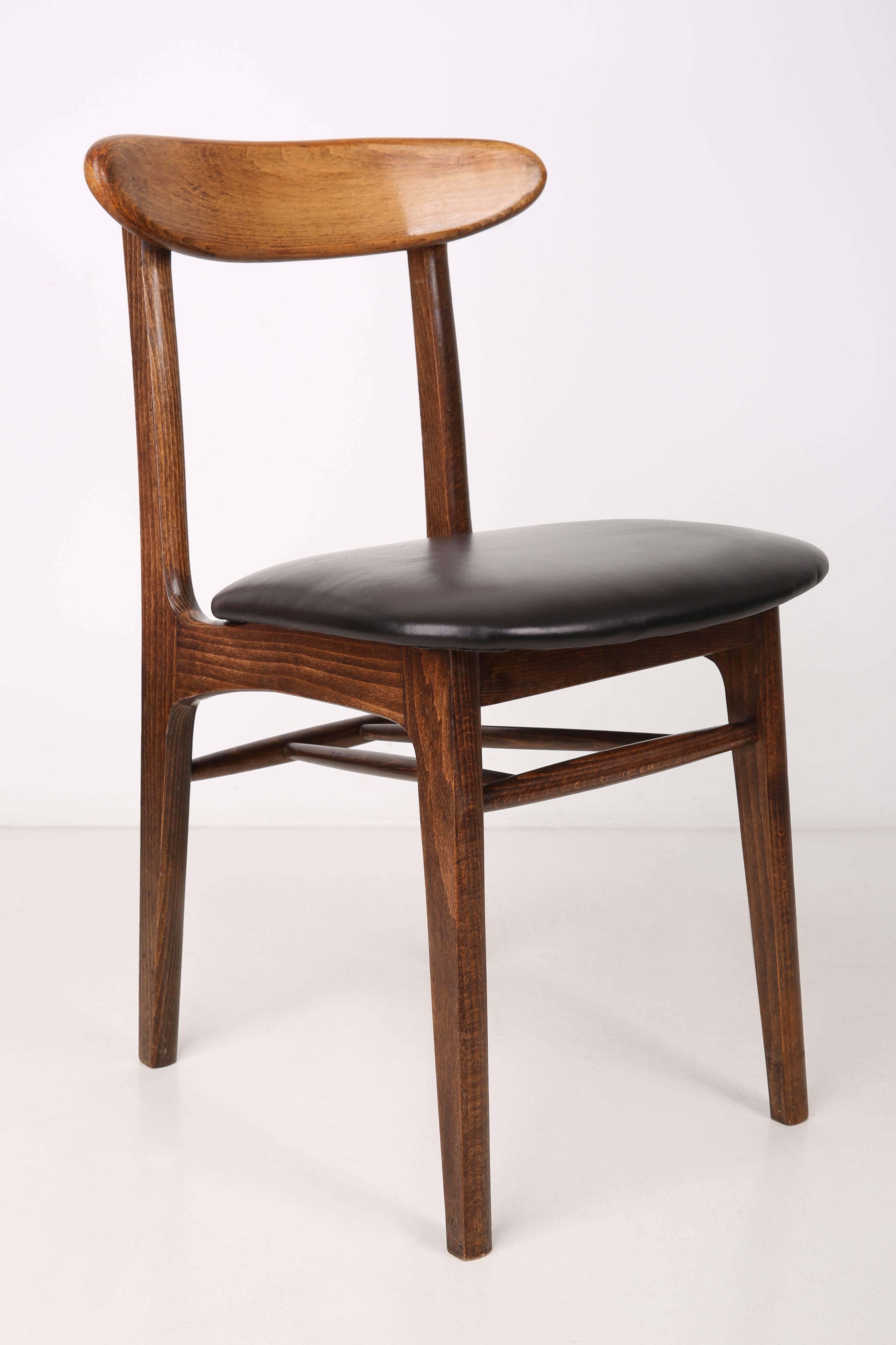 Chairs designed by prof. Rajmund Halas. They have been made of beech wood. They have undergone a complete upholstery renovation, the woodwork has been refreshed. Seats and backs were dressed in black natural cow leather. They are stable and very