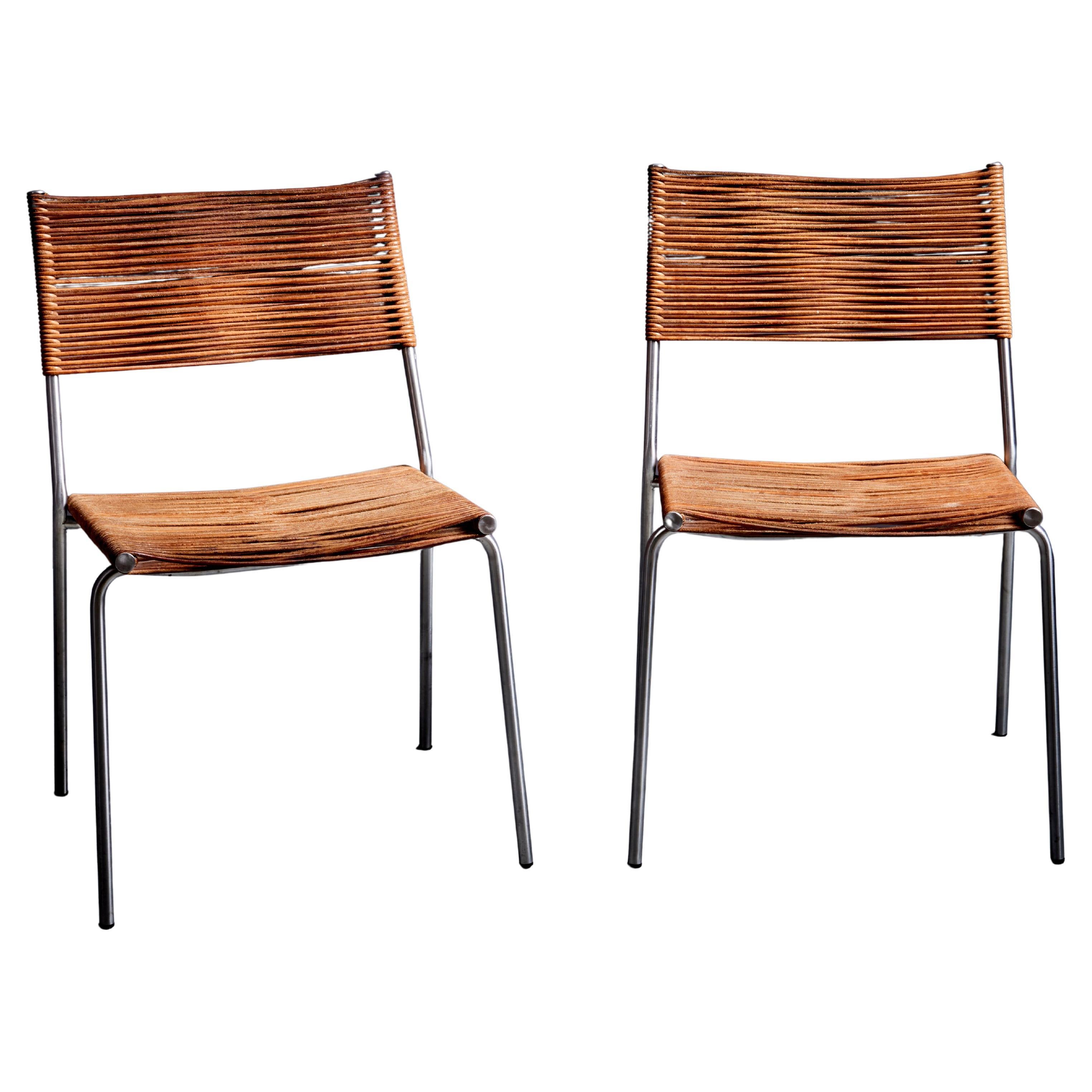 Set of two leather Bonacina Miss B2 chairs by Tito Agnoli