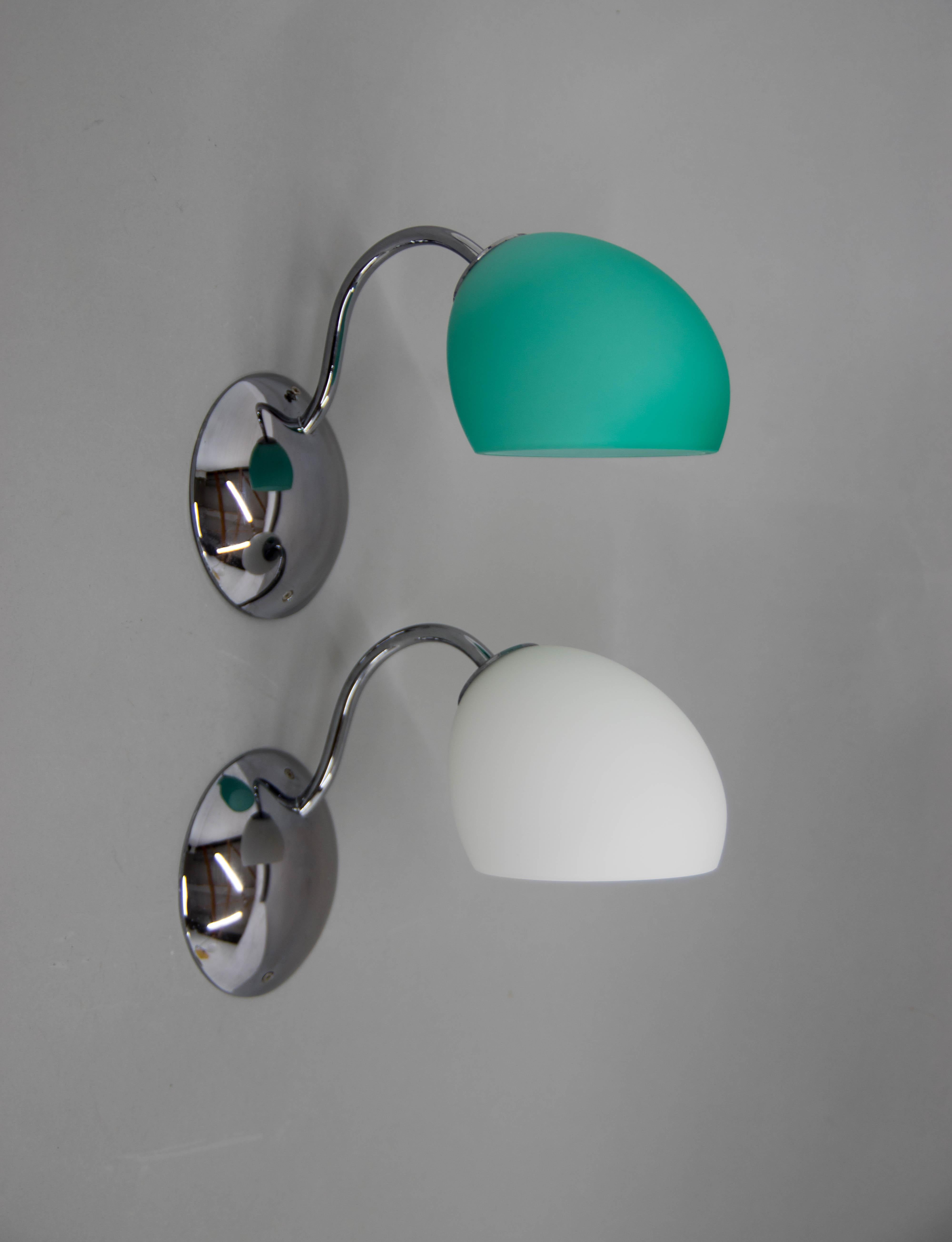 Set of two wall lights in white and azure. 
Golf P3 by Leucos lighting is a series of modern contemporary wall lights part of the Leucos Golf collection. Golf P3 are colorful wall sconce providing downward and diffused illumination from its