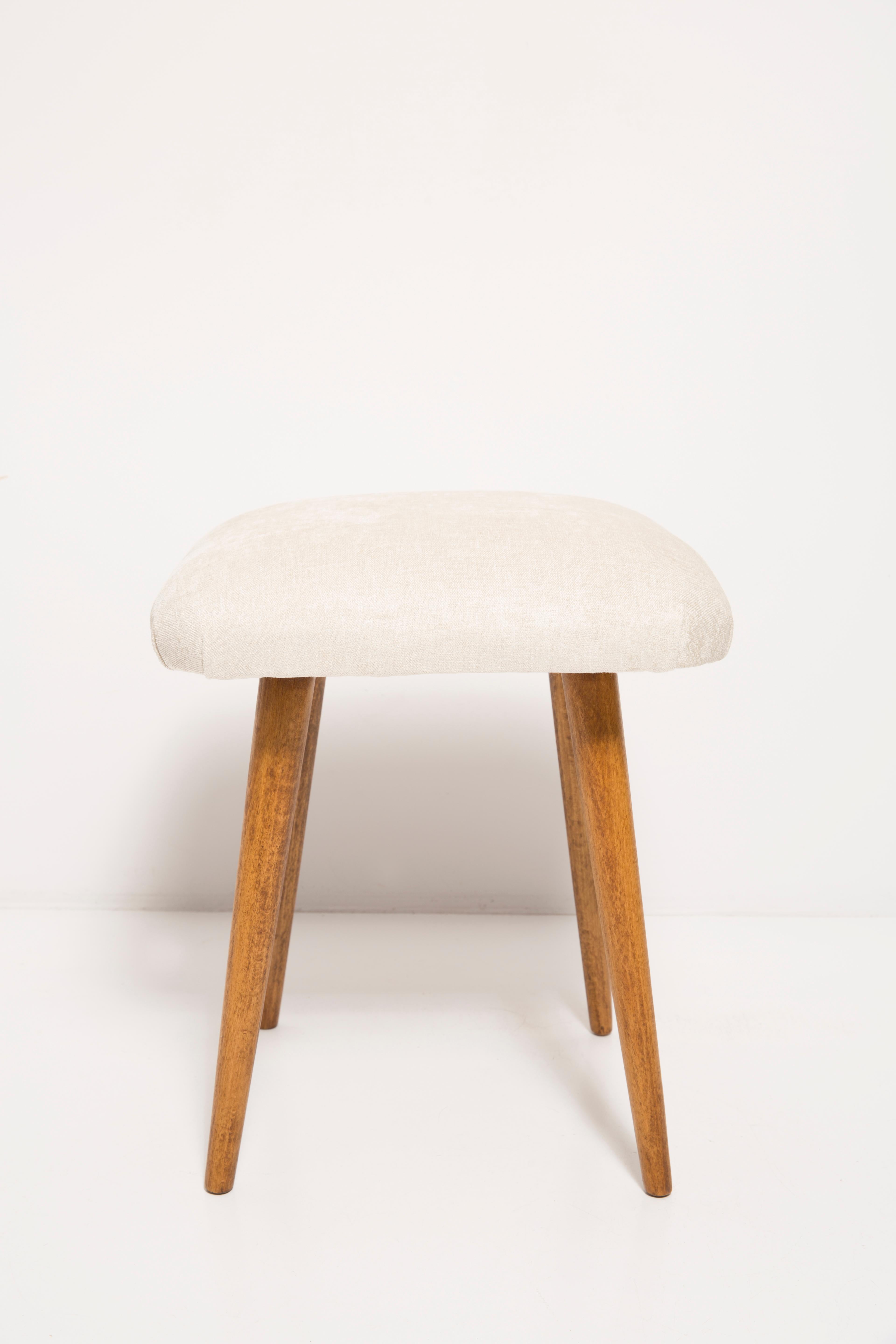 Stools from the turn of the 1960s and 1970s. Beautiful light beige upholstery. The stools consists of an upholstered part, a seat and wooden legs narrowing downwards, characteristic of the 1960s style. We can prepare this pair also in another color