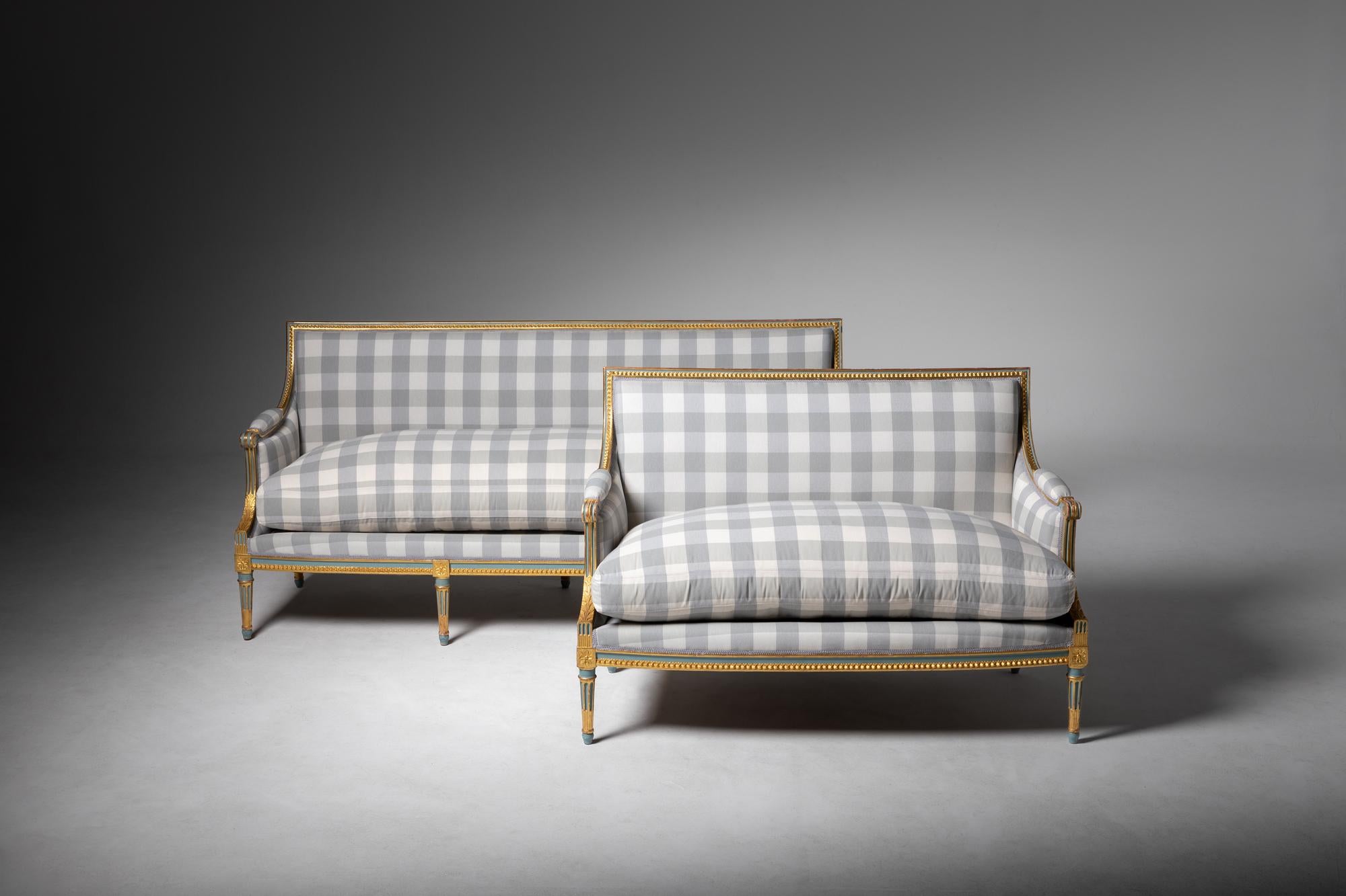 These sofas are French works by Jean Mocqué, from Paris, and were produced in the 20th century.
Louis XVI Style is characterized by straight lines, geometric shapes, symmetrical ornamentation, and neoclassical inspiration. It is typical of the late