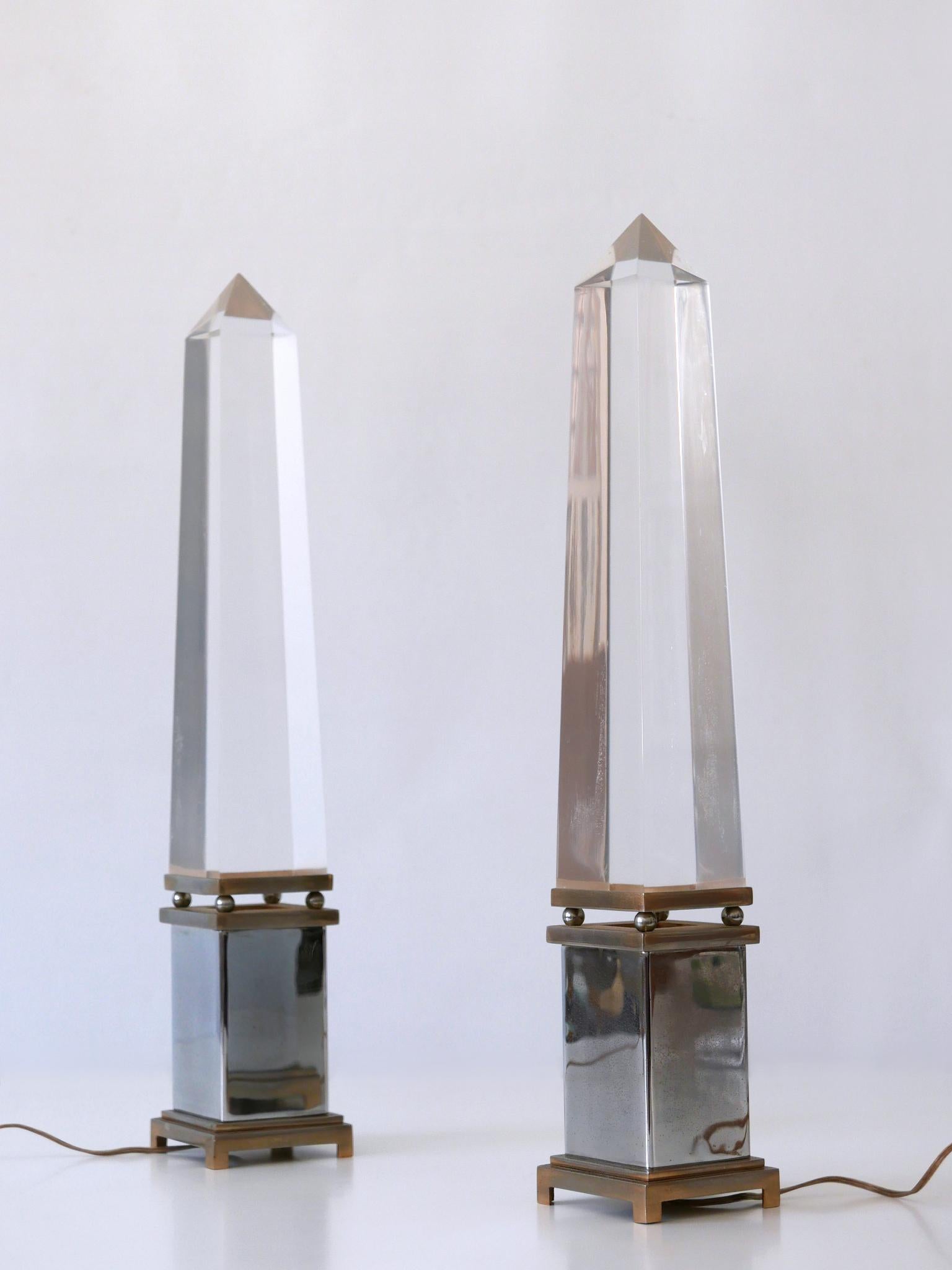 Set of two extremely rare Mid-Century Modern lucite table lamps in shape of an Obelisk. Designed by the Italian architect Sandro Petti for Maison Jansen, France, 1970s.

Executed in Lucite and metal. Each lamp needs 1 x E14 / E12 Edison screw fit