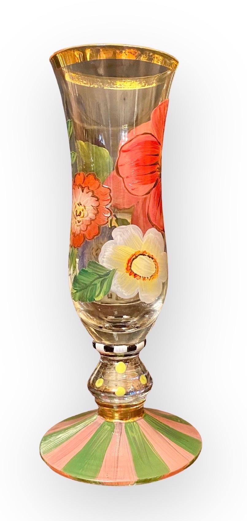 Make any occasion more special by setting the table with this pair of  Mackenzie-Child’s flower garden champagne flutes. These glasses are perfect for serving champagne, wine or summer drinks. A stunning spectrum of Courtly Stripes sets the