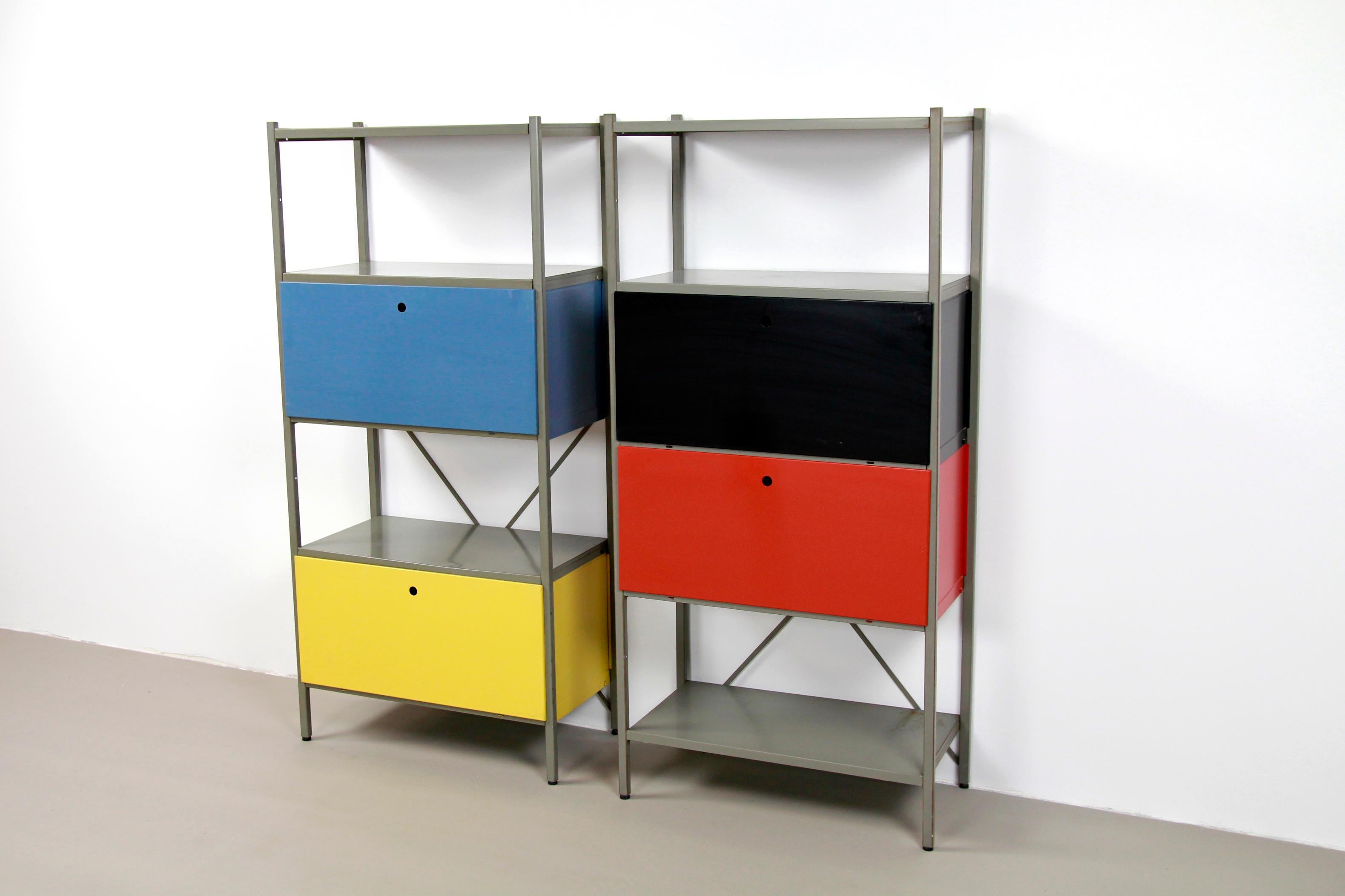 Beautiful modular cabinet designed by Wim Rietveld (son of Gerrit Rietveld) and manufactured by Gispen, The Netherlands. This wall cabinet is made of lacquered sheet steel. With the help of yokes, shelves, cover plates + doors, a wall unit could be