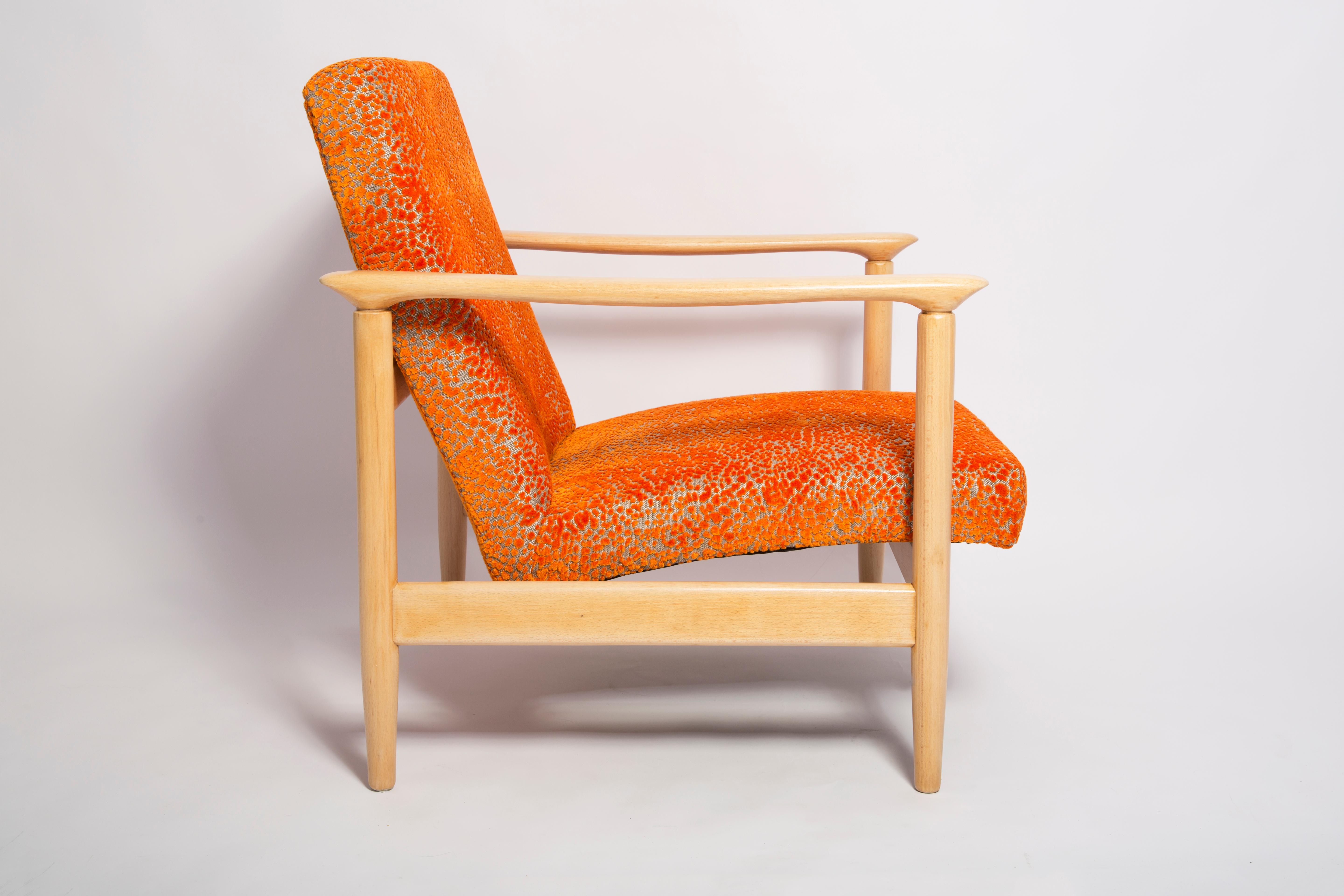 Beautiful bright orange velvet Armchairs GFM-142, designed by Edmund Homa, a polish architect, designer of Industrial Design and interior architecture, professor at the Academy of Fine Arts in Gdansk. 

The armchairs was made in the 1960s in the