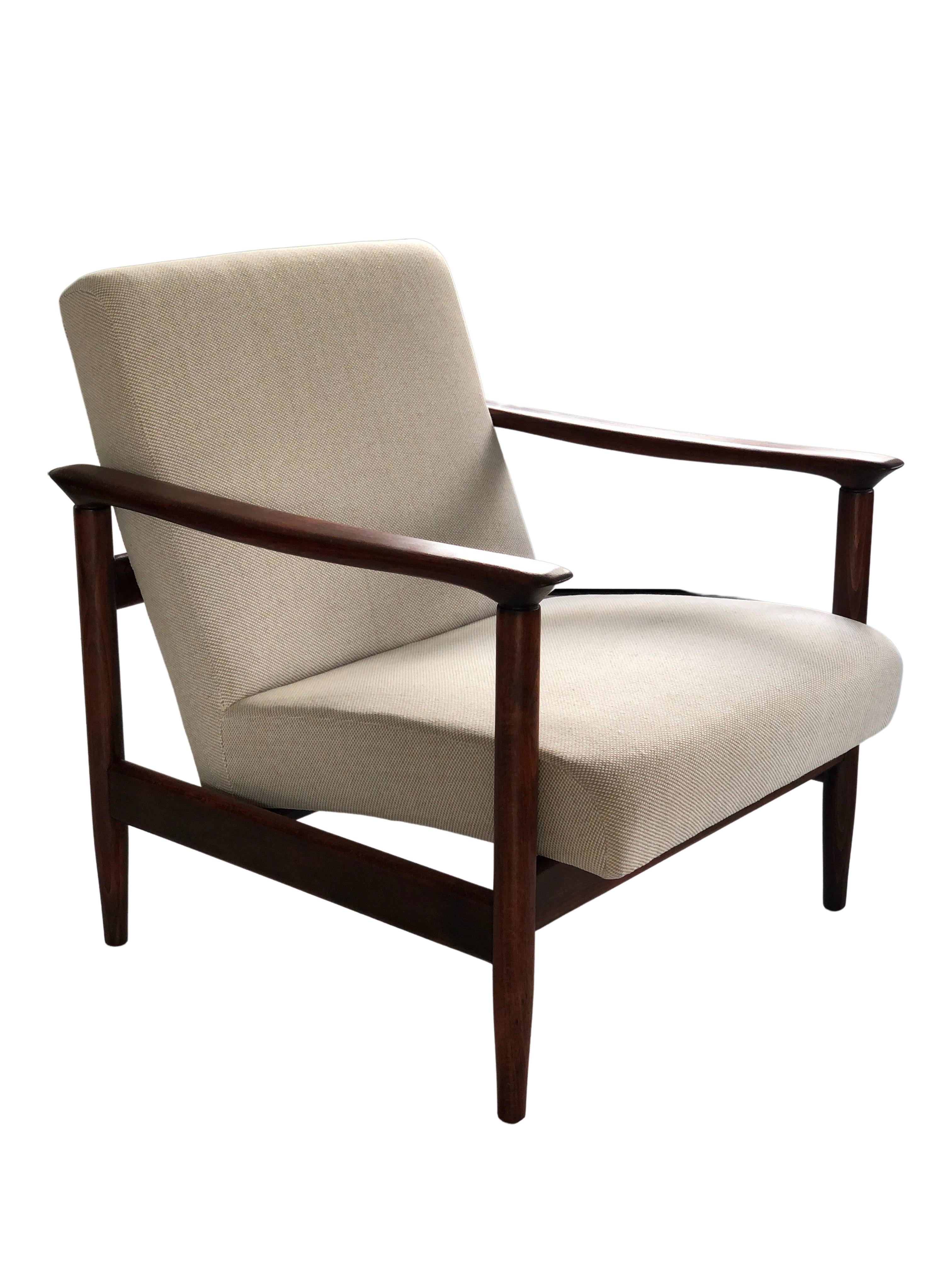 One of the icon of Polish mid-century design, a pair of beige armchairs, designed by Edmund Homa - Polish architect, industrial and interior design designer, professor at the Academy of Fine Arts in Gdansk. The set has been manufactured by