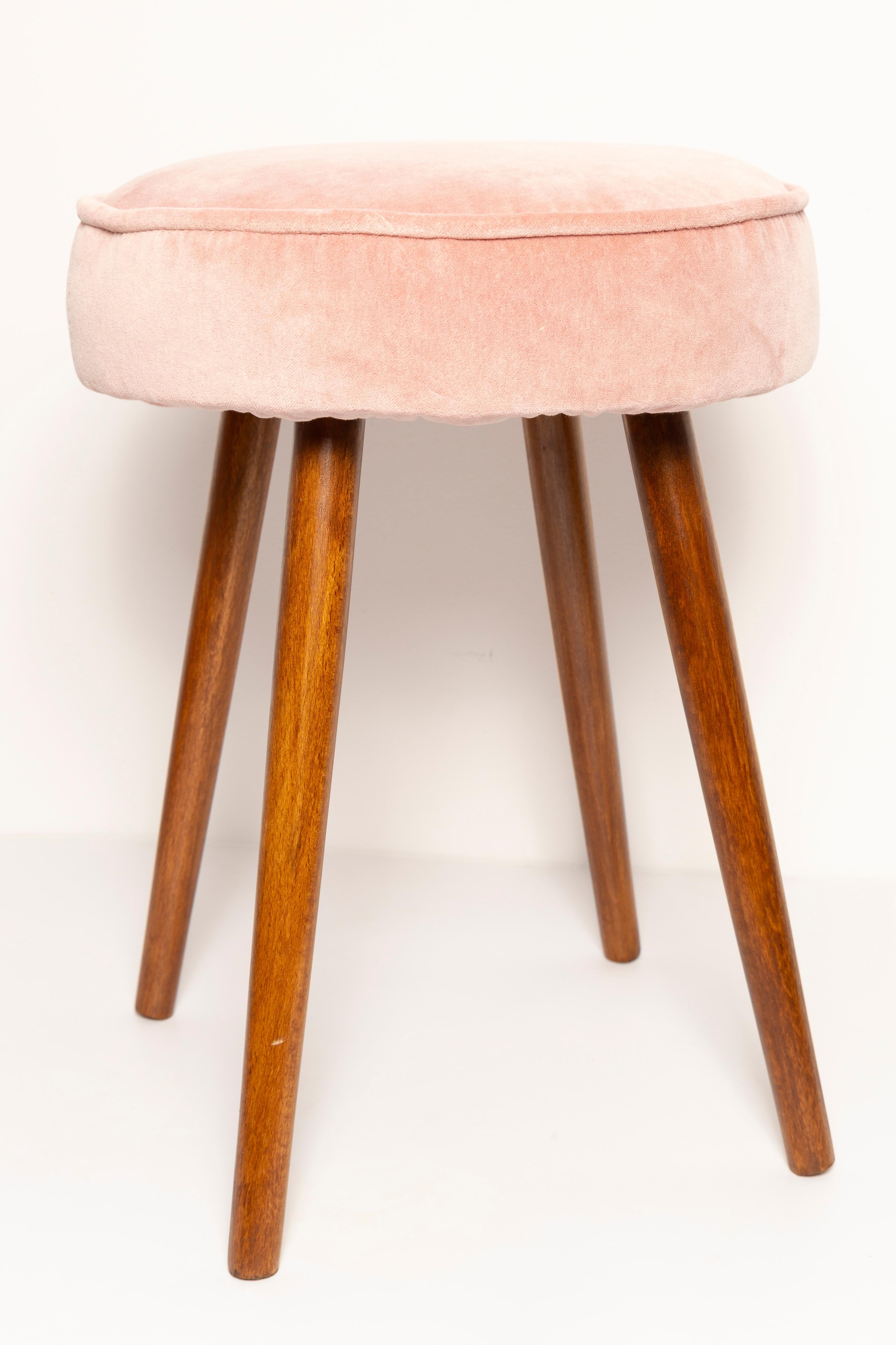 Stools from the turn of the 1960s and 1970s. Beautiful baby pink upholstery. The stool consists of an upholstered part, a seat and wooden legs narrowing downwards, characteristic of the 1960s style. We can prepare this pair also in another color of