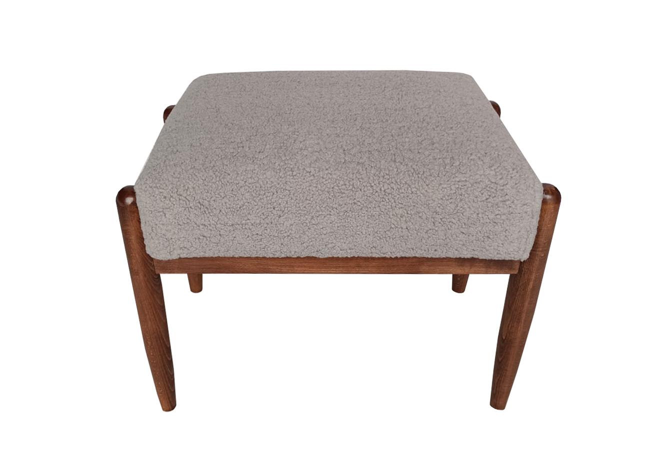 Stool from the turn of the 1960s. The stool consist of an upholstered part, a seat and wooden legs narrowing downwards, characteristic of the 1960s style.

Stool was designed by Edmund Homa, a Polish architect, designer of industrial design and