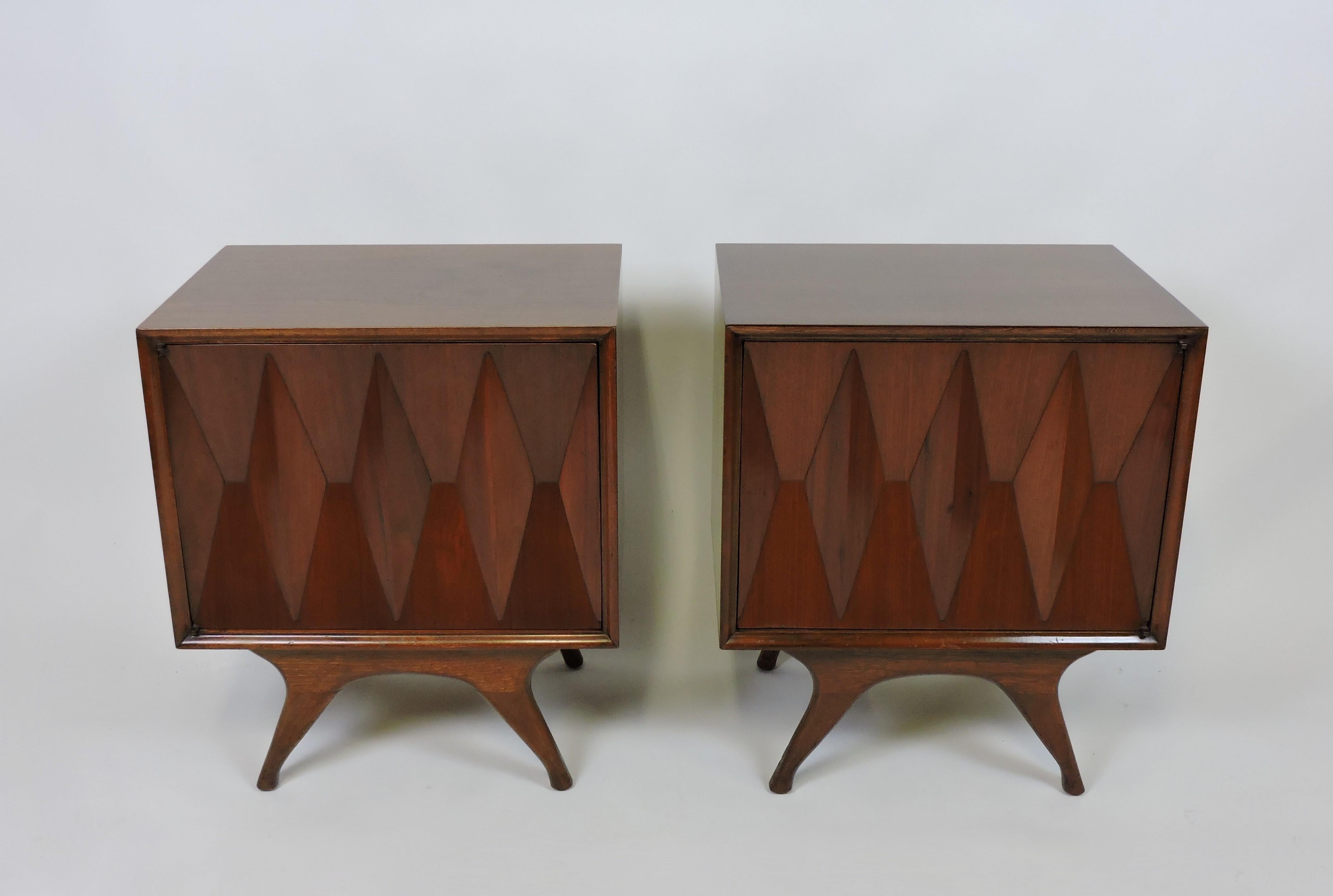 Very cool Albert Parvin diamond front nightstands/end tables. These tables have sculpted 3- dimensional fronts in a diamond pattern along with graceful splayed legs. Each has an adjustable shelf and push-to-open mechanisms on the doors.