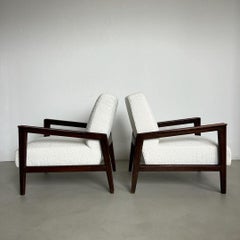Set of two Mid Century Modern armchairs in walnut and white boucle upholstery