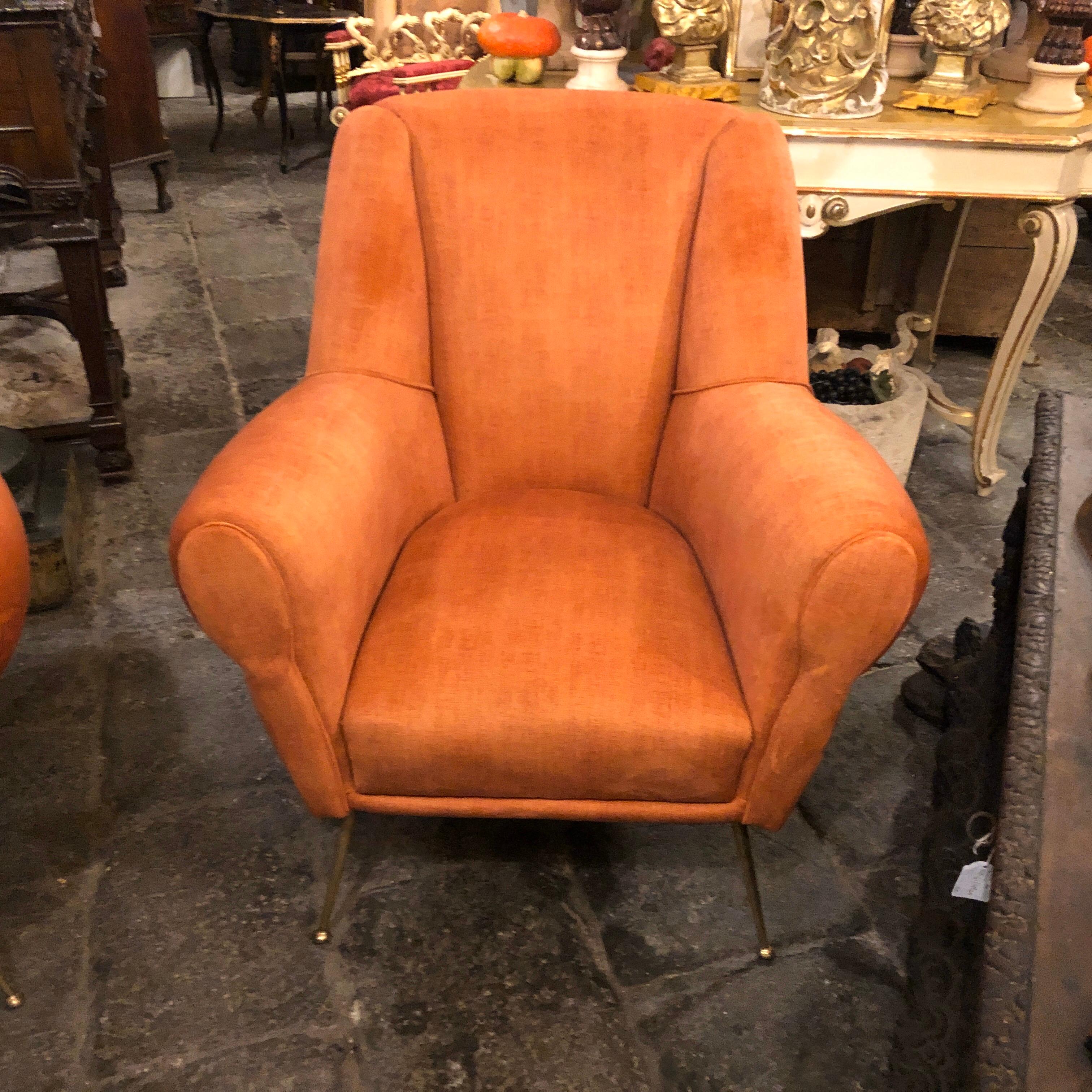 Two orange velvet and brass armchairs in the style of Gio Ponti designed and manufactured in Italy in the 1960s, they have been recently upholstered in an amazing orange velvet.