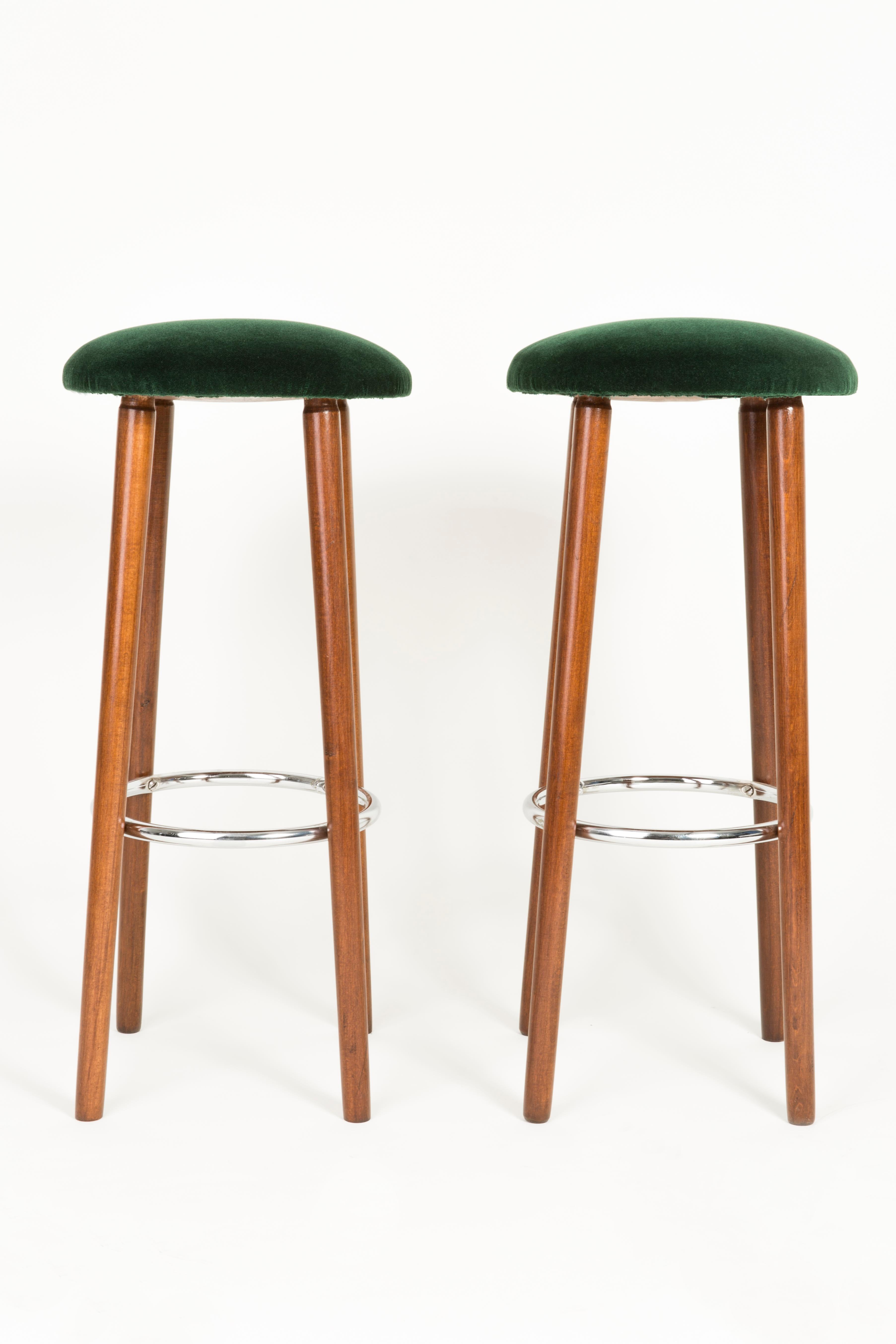 Stools from the turn of the 1960s and 1970s. Beautiful, well crafted dark green upholstery. The stools consists of an upholstered part, a seat and wooden legs narrowing downwards, characteristic of the 1960s style. We can prepare this set also in