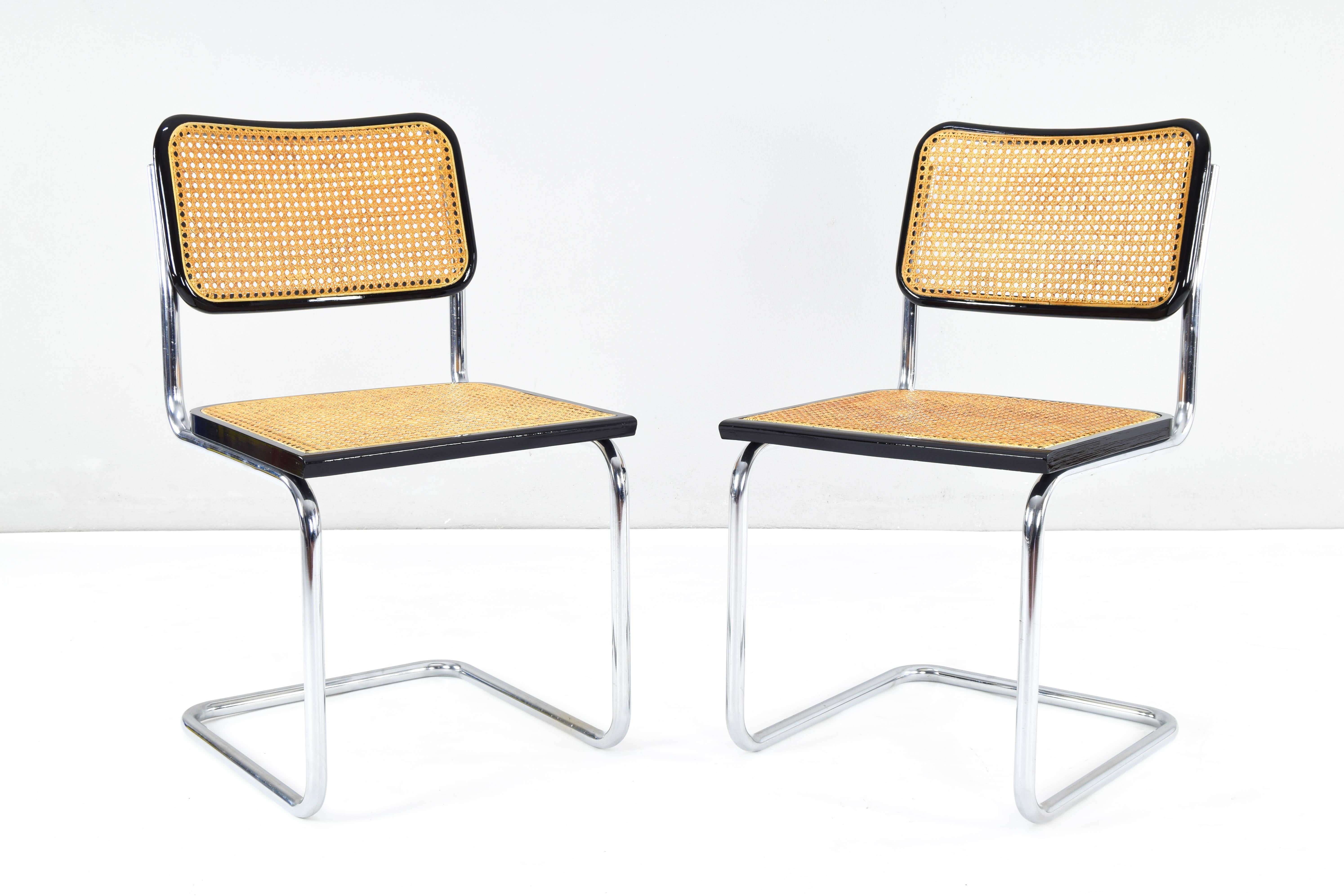 Set of two Cesca chairs, model B32, made in Italy in the 1970s. Black lacquered beech wood frames and Viennese natural grid. The grills of the two seats and backs have been put new. 
Very good general condition.

Measures: Total height 86