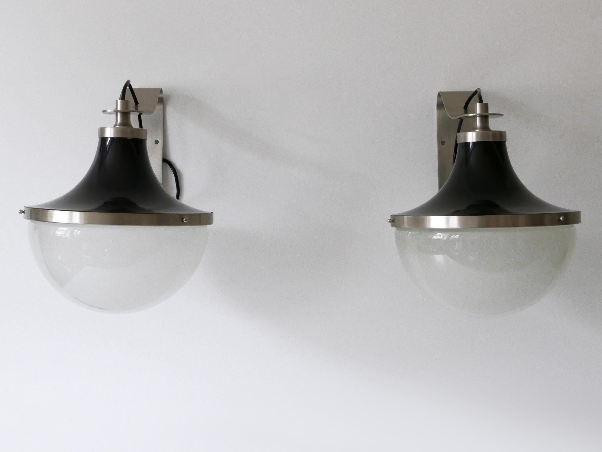 Set of two Mid-Century Modern nickel-plated brass sconces 'Pi'. Designed by Sergio Mazza for Artemide, Italy, 1960s.

Executed in nickel-plated brass and glass; each sconce needs 1 x E27 / E26 Edison screw fit bulb. The sconces are with original