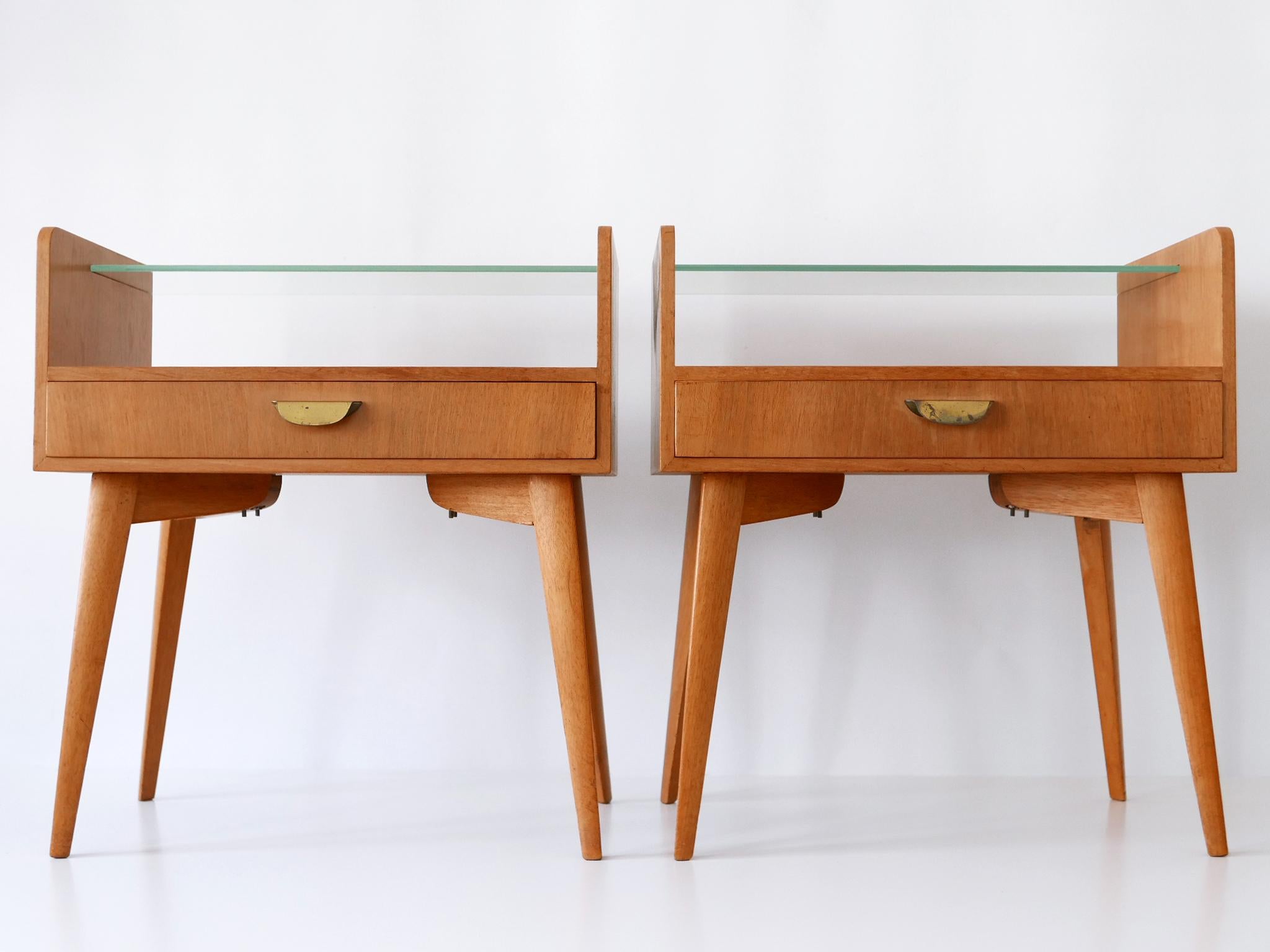 Set of two elegant and highly decorative mid century modern nightstands by WK Möbel, Germany, 1950s. Suitable for the wall mounting. With metal label inside the drawers.

Executed in walnut and brass.

The nightstand will be disassemble for safe