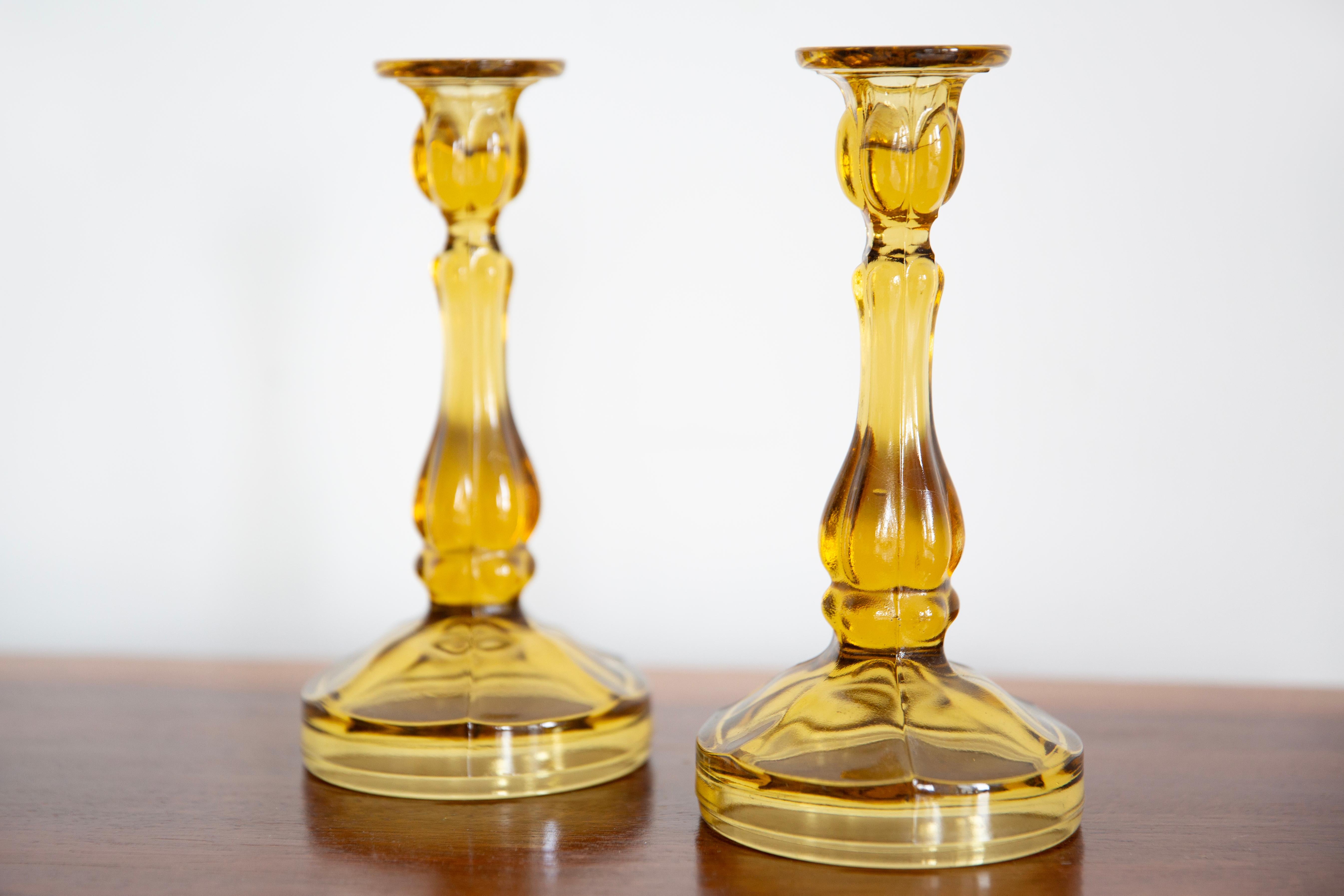 Set of two midcentury Polish modern glass candlesticks, circa 1960. 
Very good condition. No damages. Beautiful yellow glass.
