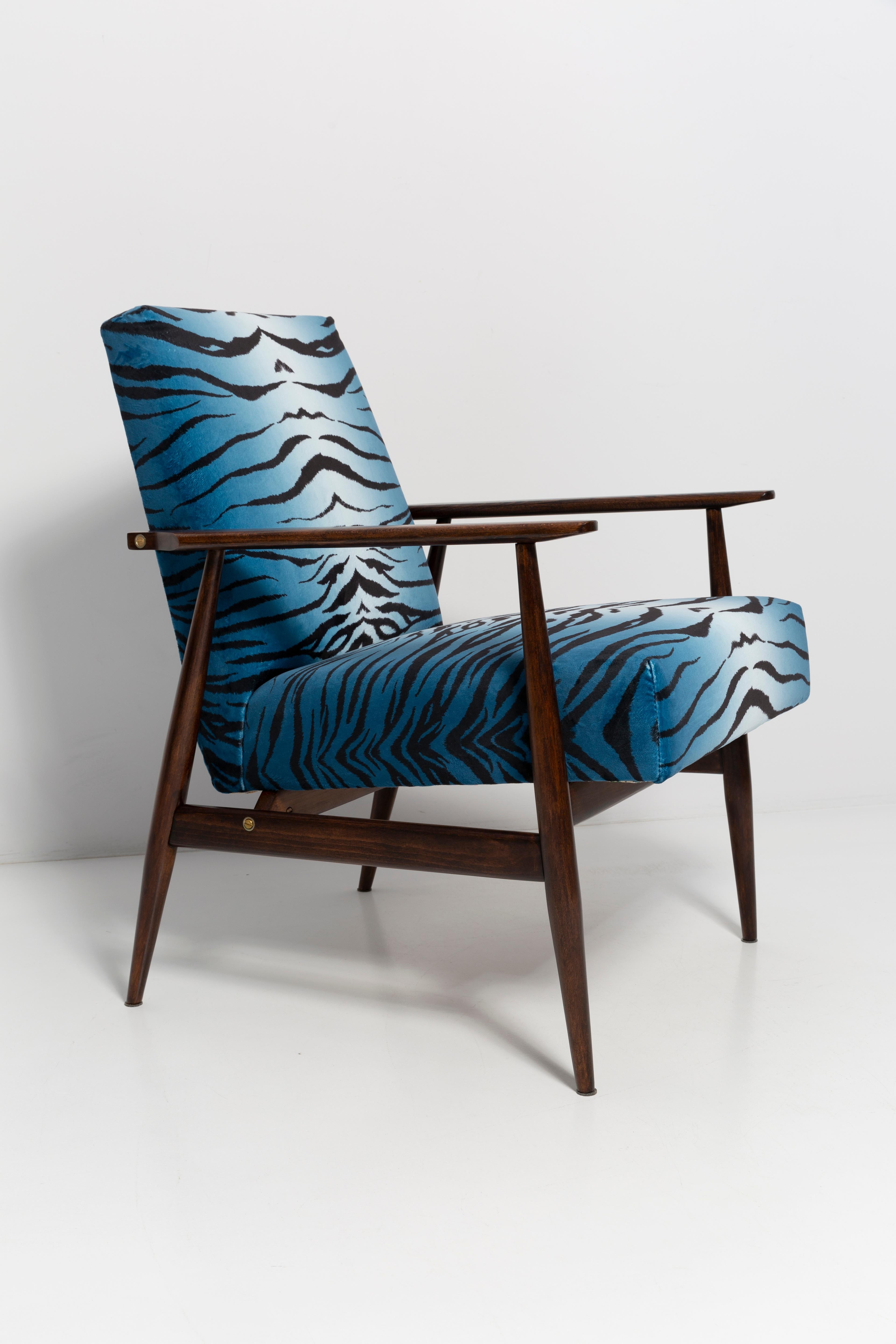 A beautiful, restored armchairs designed by Henryk Lis. Furniture after full carpentry and upholstery renovation. The fabric, which is covered with a backrest and a seat, is a high-quality Italian velvet upholstery printed in blue zebra pattern. The