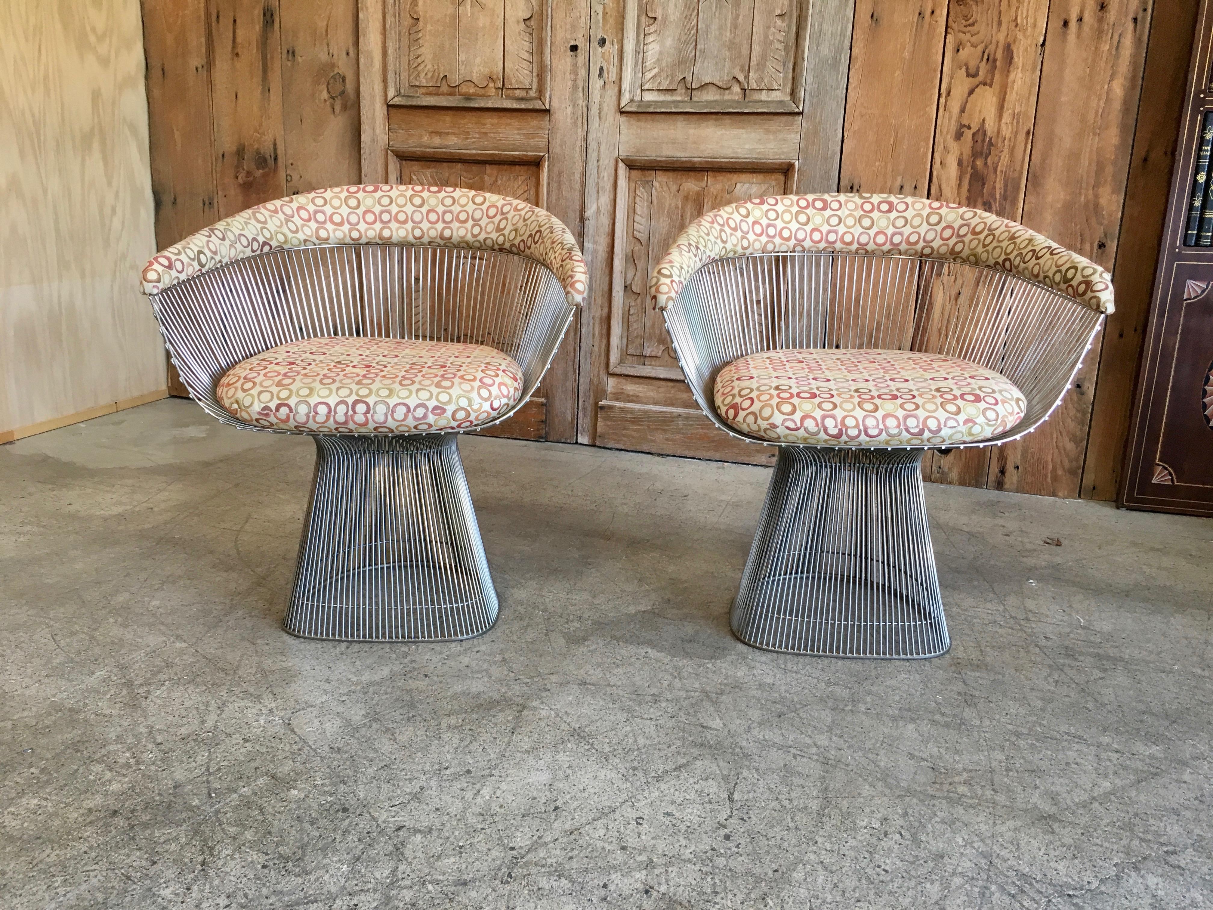 Set of two chrome nickel chairs recently polished new upholstery recommended.