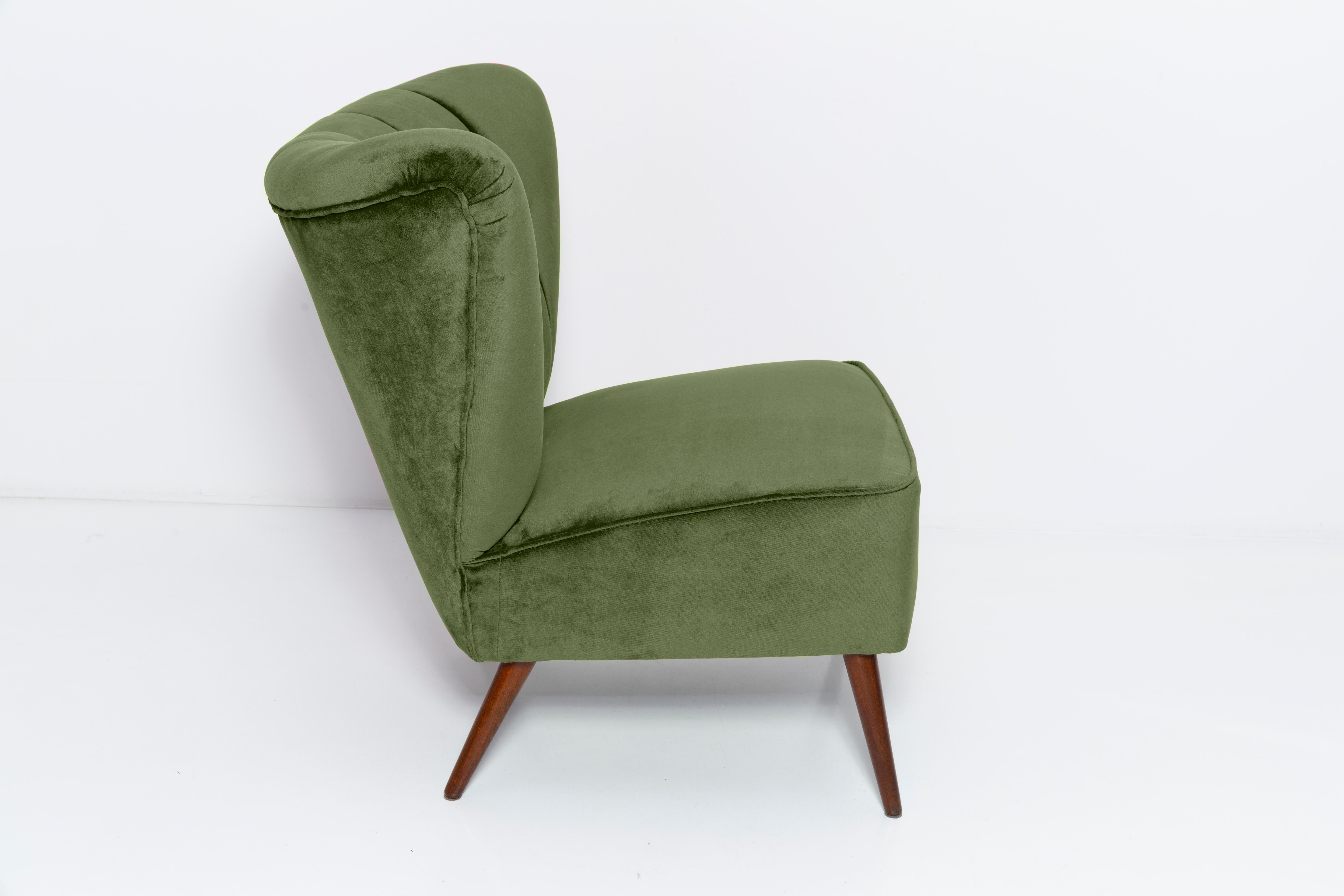 Springy, very comfortable and stabile club seats. Produced in the 1960s at the Karl Lindner factory in Germany. The whole armchair is covered with high-quality italian green velour (color 963). The armchairs are after a complete upholstery and