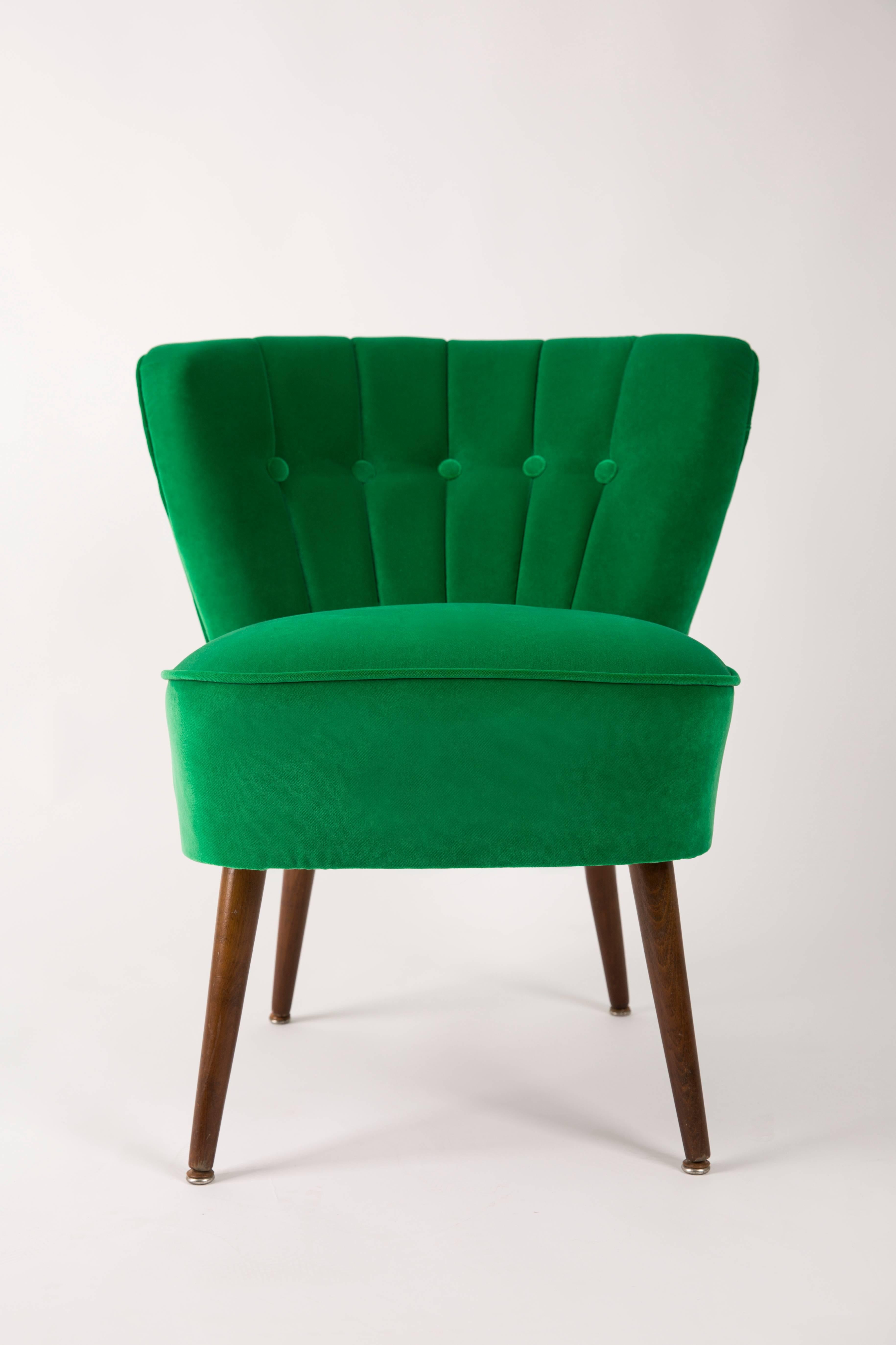 Springy, very comfortable and stabile polish club seat. Produced in the 1960s at the Karl Lindner factory in Germany. The whole armchairs is covered with high-quality green velour (color number 39). The armchairs are after a complete upholstery and
