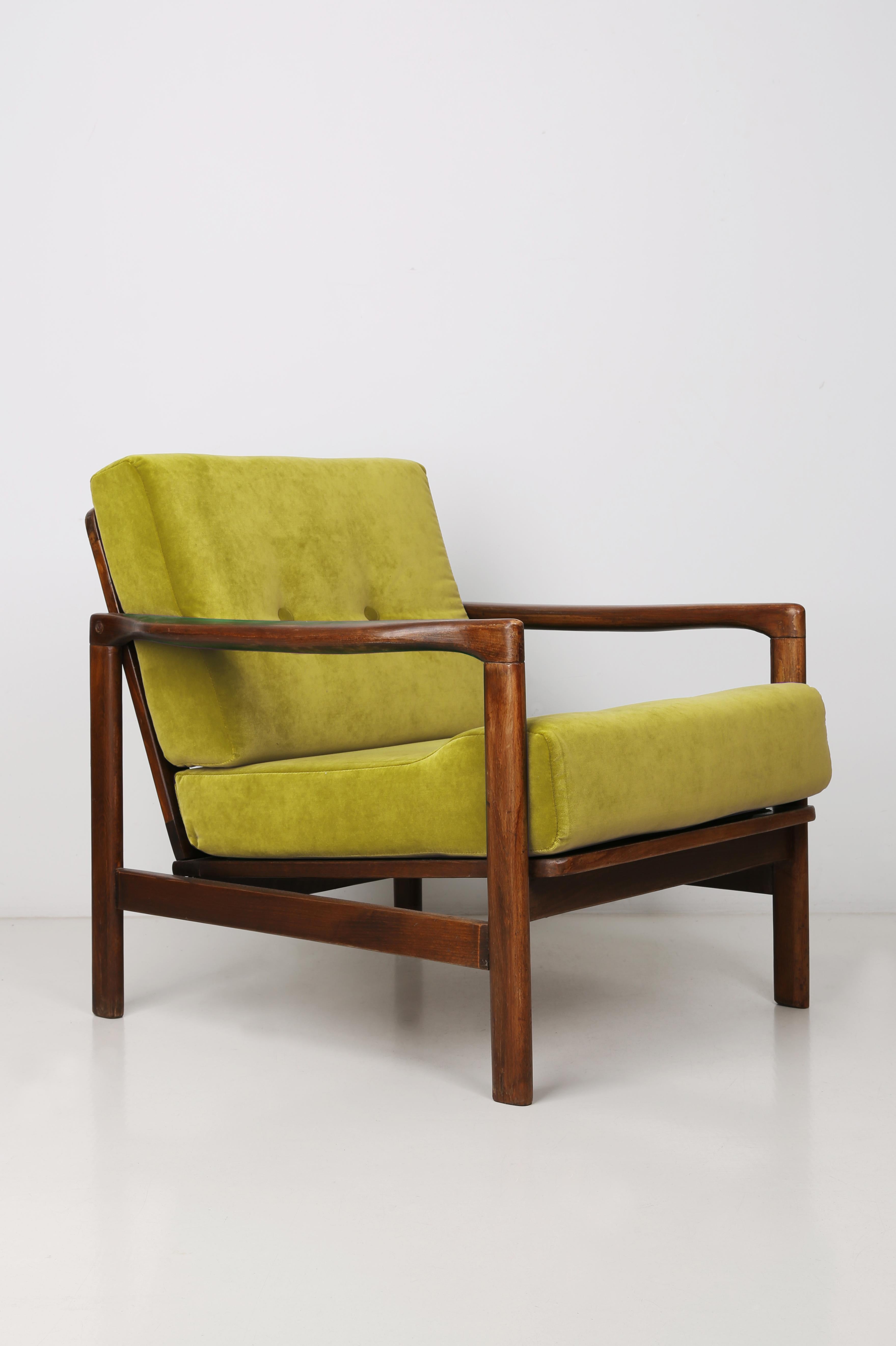 The B-7522 armchairs was designed in the 1960s by Zenon Baczyk, it was produced by Swarzedz Furniture Factories in Poland. Furniture kept in perfect condition, after full upholstery and wood renovation. Stabile and very comfortable armchair, dressed