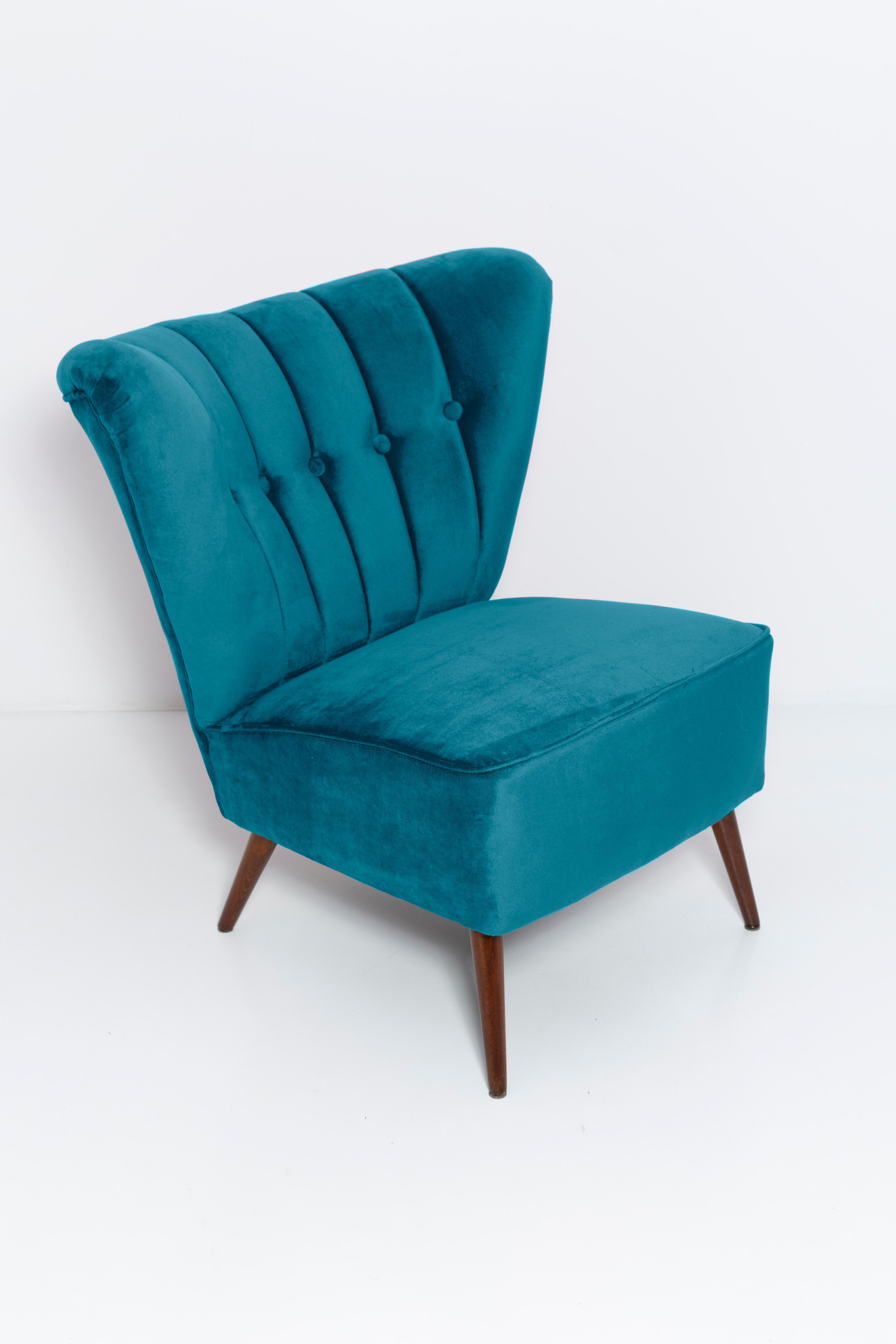 Springy, very comfortable and stabile club seats. Produced in the 1960s at the Karl Lindner factory in Germany. The whole armchair is covered with high-quality italian petrol blue velour (color 973). The armchairs are after a complete upholstery and